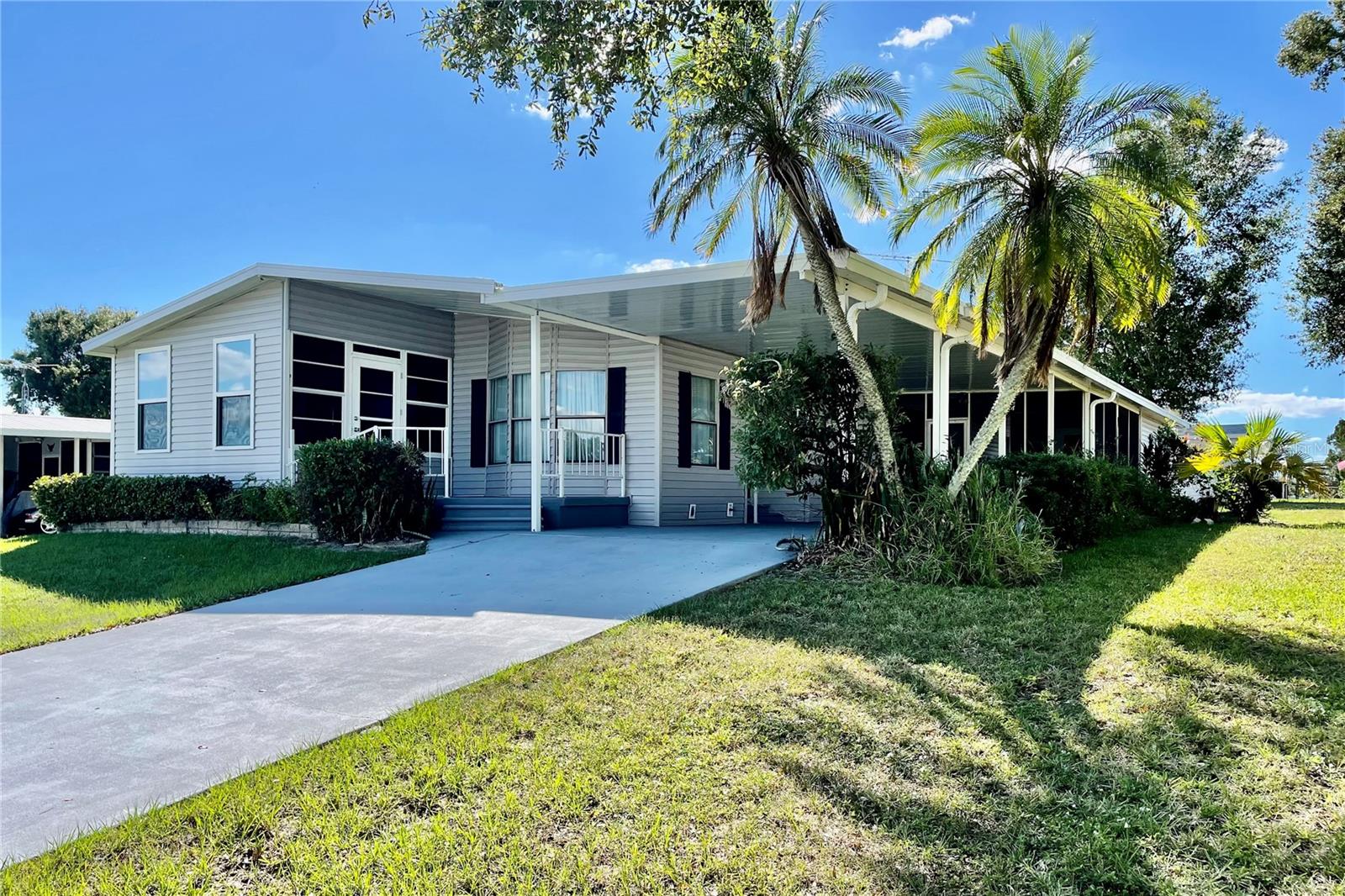 Charming Florida retreat nestled in the peaceful 55+ Knoll-Century Hill community. This beautifully updated, move-in ready home sits on owned land with no lot rent, offering full ownership and added privacy. 

The inviting front porch deck provides a great spot to relax, and inside you’ll find brand new luxury vinyl plank flooring throughout. The renovated Florida room is filled with natural light and serves as a versatile second living space, perfect for relaxing or entertaining year round. It also includes an enclosed lanai, allowing you to enjoy the outdoors comfortably in any season.

Additional updates include a new washer and dryer. Outside, the home features a covered carport and two storage sheds, providing ample space for parking, tools, and extra storage. This is Florida living done right. Schedule your private showing today!