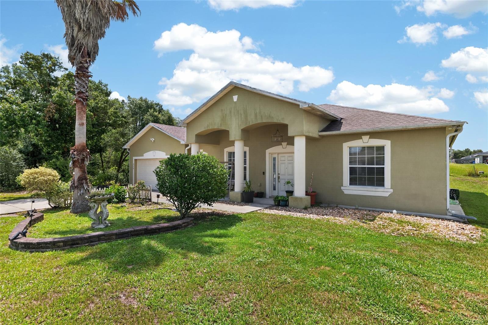 Welcome home to this beautifully maintained and impeccably cared-for residence, perfectly situated in one of Southwest Ocala's most convenient locations. Offering over 2,040 square feet of thoughtfully designed living space on a 0.23-acre homesite, this 3-bedroom, 2-bathroom home combines comfort, style, and everyday functionality. From the moment you arrive, you'll appreciate the lush landscaping and inviting curb appeal. Step inside to discover a versatile front living area that can easily serve as a formal living room, home office, playroom, or flex space to fit your lifestyle. The desirable split-bedroom, open-concept floor plan creates an inviting flow that's perfect for both entertaining and everyday living. The spacious eat-in kitchen is truly the heart of the home, featuring a large prep island, breakfast bar, pantry, abundant cabinetry and countertop space, plus newer stainless steel appliances  that make meal preparation a breeze.
Retreat to the generous primary suite, designed for relaxation with a spa-inspired en-suite bath offering a soaking tub, separate walk-in shower, dual vanity with a dedicated makeup station, and plenty of room to unwind after a long day. Step outside to the screened lanai and enjoy your own peaceful backyard oasis, surrounded by mature shade trees that create the perfect setting for morning coffee, evening gatherings, or simply soaking in Florida's year-round sunshine. This home has been lovingly updated with valuable improvements, including a new A/C (2023), new carpet (2021), a water softener, and a brand-new roof scheduled for completion within the next few weeks, providing added peace of mind for years to come.
Location truly sets this home apart. Conveniently located in the heart of Southwest Ocala, you'll enjoy quick access to major highways, shopping, dining, medical facilities, and entertainment, making daily life both easy and enjoyable. This exceptional home is truly move-in ready and offers the perfect blend of space, updates, and an unbeatable location. Don't miss your opportunity to make it yours!