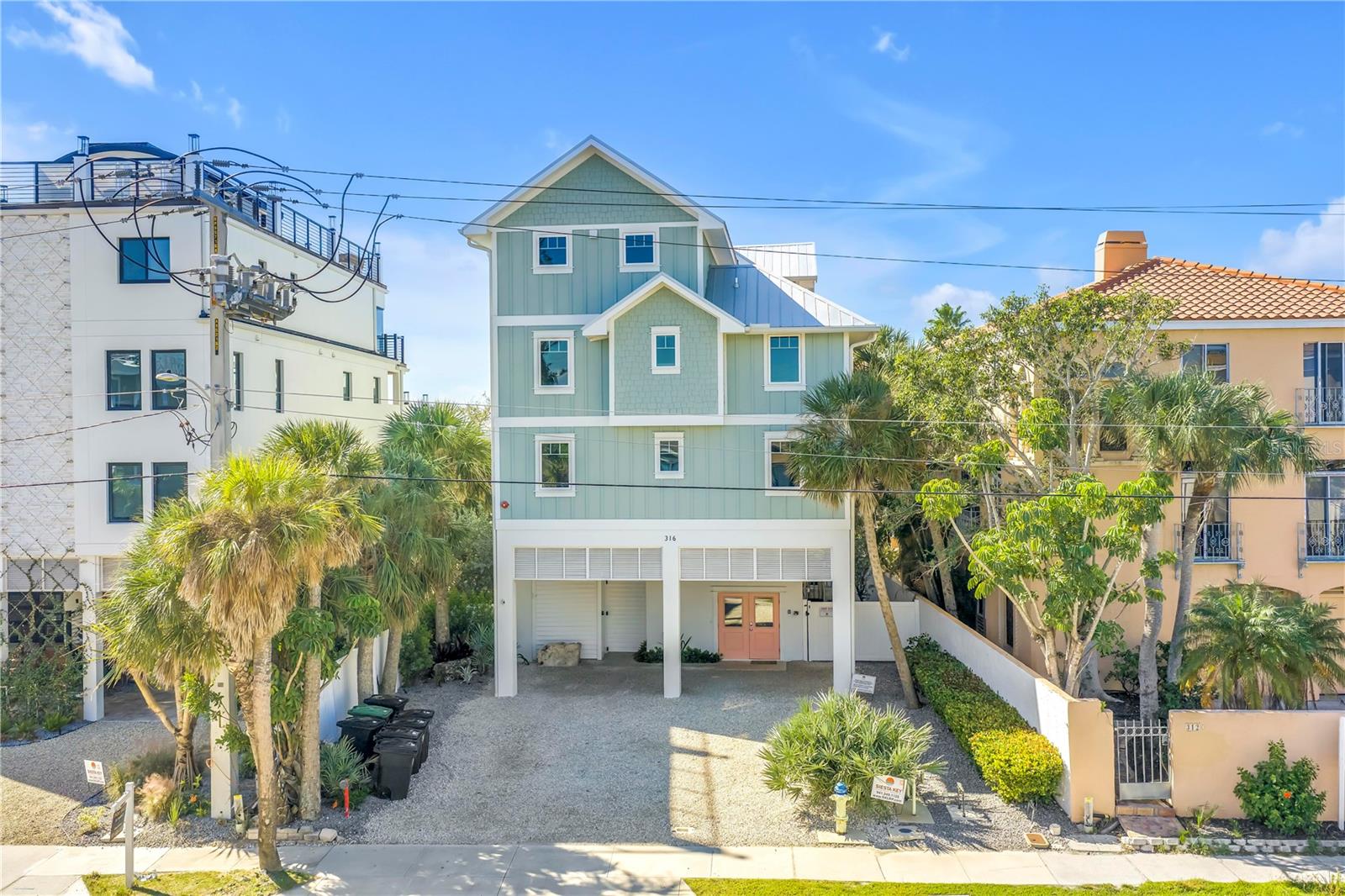 Just steps from the shoreline, this coastal home offers deeded beach access and sweeping panoramic views of the Gulf. Completely remodeled in 2021, the property lives and performs like new construction, blending modern coastal design with durable, rental-ready finishes throughout.
Thoughtfully designed across three living levels and serviced by a private elevator, the home features 8 bedrooms, 8 full baths, and 2 half baths, with expansive gathering spaces suited for both everyday living and hosting. With a proven track record as a high-performing short-term rental, the property generates approximately $400,000 to $500,000 annually, offering strong income potential alongside its lifestyle appeal. The top floor serves as the heart of the home, where the main kitchen and primary living area open directly to a Gulf-facing balcony showcasing breathtaking, unobstructed water views. This elevated vantage point creates a stunning backdrop for daily living, with the kitchen, dining space, and great room all positioned to take in the scenery.
A secondary club room with wet bar provides an additional space to gather, while multiple balconies throughout the home frame the coastal setting from different vantage points, including select bedroom suites. Below, the outdoor living space features a private pool and integrated spa surrounded by lush landscaping, along with a fully equipped outdoor kitchen with built-in grill, refrigeration, and dining area.
All eight bedroom suites offer ensuite baths and generous accommodations, with several enjoying Gulf views and private balcony access. Located near beach access and Siesta Key Village, this is a rare opportunity to own a fully renovated coastal home that delivers both luxury living and compelling investment performance.