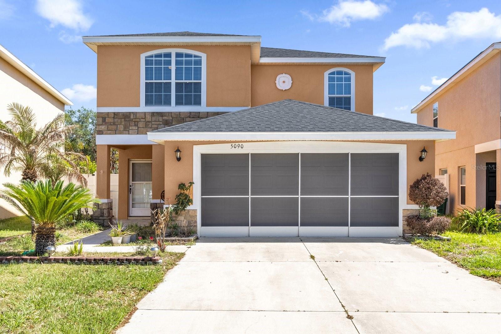 Welcome to 5090 NE 122nd Blvd in Oxford, FL—an exceptional, move-in ready home located in the highly desirable Villages of Parkwood, non–age-restricted community. This beautifully renovated 4-bedroom, 3.5-bath residence offers the perfect combination of modern design, functional space, and peaceful surroundings.

Step inside to discover a bright and open-concept layout filled with natural sunlight, enhanced by a fresh interior paint and a sleek, contemporary feel throughout. The entire main level is tiled, while the second floor features warm wood flooring, creating a stylish, carpet-free home that’s both elegant and easy to maintain. The thoughtfully designed floor plan offers separate living and family rooms, providing flexibility for entertaining and everyday living.
Enjoy peace of mind with a brand new roof (2025) and appreciate the home’s modern updates that make it truly turn-key. Out back, unwind in your private retreat featuring lush greenspace views with no direct rear neighbors, offering rare privacy and a serene atmosphere.
Situated in a gated community, residents of Villages of Parkwood enjoy a variety of amenities including a clubhouse, fitness center, resort-style pool, playground, and tennis courts—perfect for an active lifestyle.

The location is unbeatable—just minutes from The Villages, with convenient access to shopping plazas, restaurants, and entertainment. You’re also close to the new Costco and less than two miles from The Villages Charter School, making this home ideal for both convenience and lifestyle.
This is a rare opportunity to own a modern, private, and beautifully updated home in one of the area’s most desirable communities—schedule your showing today!