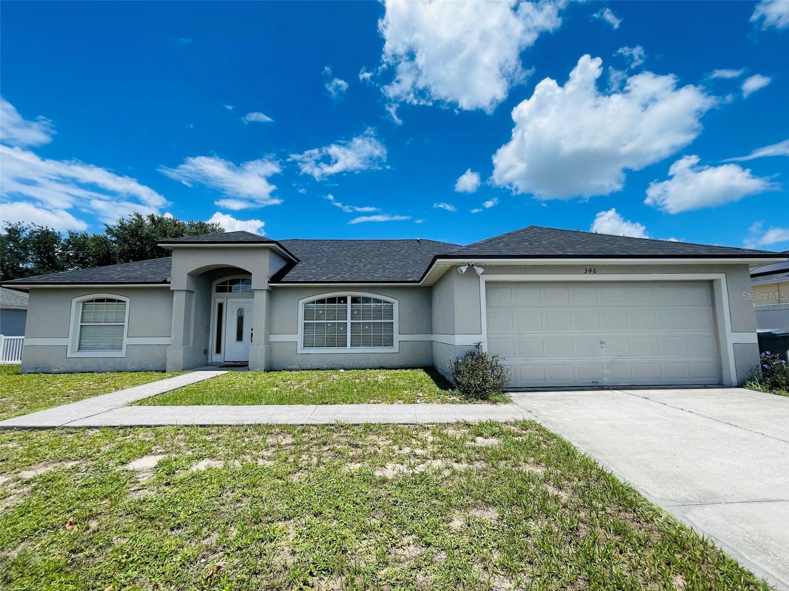 NEW ROOF. NEW KITCHEN. 1,870 SQFT — THE BIGGEST VALUE ON THE STREET. Stop scrolling — this is the one the neighborhood will talk about. At 1,870 square feet, this 3-bedroom, 2-bath home is among the largest on Puffer Court — and it just received the two upgrades every buyer prays for but almost never gets: a brand-new shingle roof (2024) with a transferable 5-year warranty and a complete designer kitchen renovation. Step into a kitchen that looks like it came off a magazine cover: crisp 36-inch white shaker cabinets, gleaming quartz countertops, and a full suite of brand-new appliances — range, range hood, refrigerator, microwave, and garbage disposal. Nothing to replace. Nothing to fix. Just move in and start cooking. Here's the math that makes this a no-brainer: a new roof (~$15K value) plus a full kitchen renovation (~$25K+ value) means $40,000+ in upgrades already done for you — savings you'd never recover buying the "cheaper" fixer down the street. Insurance companies love 2024 roofs. Lenders love them. Your wallet will love them. The split floor plan delivers privacy to the owner's suite while an open living area floods with natural Florida light. Take advantage of the Flex Room and make it your home office or turn it into your guest bedroom (bedroom #4). A 2-car garage with extra room for tools and a workbench. Outside, enjoy a generous lot with room to relax, set your patio furniture and BBQ. And the location seals the deal: nestled in Poinciana, where your low HOA lets you enjoy community pools, parks, playgrounds, sports fields, and miles of trails. You're minutes from Poinciana Medical Center, Publix, shopping, dining, schools, and Valencia College's Poinciana campus, with Poinciana Parkway putting Orlando, Disney, and I-4 within easy reach. Homes on this street are selling — one closed just weeks ago above $325K. With a new roof, a new kitchen, and this much square footage, this home will not wait for you. Schedule your private showing today — the buyer who hesitates on this one will be the buyer who writes about "the one that got away."