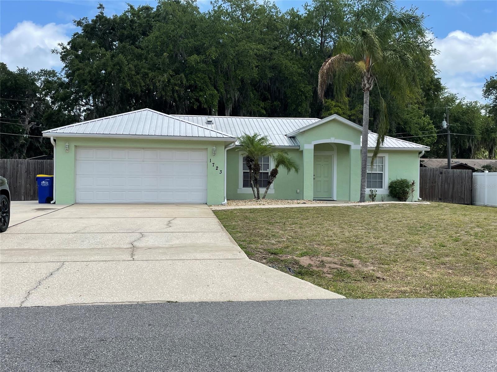 Well cared for 3 bedroom, 2 bath block home with open floor plan.  Updates include newer metal roof, hot water heater, interior and exterior paint, and A/C 2019.  Tile floors run throughout the living, dining, kitchen, laundry, and bathrooms and laminate in the bedrooms.  The cathedral ceilings help make the home feel larger than it really is and the kitchen offers a breakfast bar and bay windows looking into the beautiful backyard.  A large enclosed back porch with tile flooring and vinyl windows offer a great space for outdoor entertaining or just relaxing.  Plenty of parking available with a double car garage and extra concrete pad next to driveway.  Backyard is fully fenced and offers lots of shade.  Located close to schools, shopping, beach and river. ;Water: City
