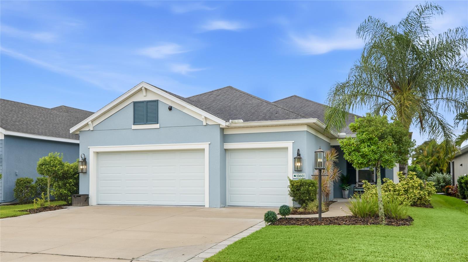 Welcome to Silverleaf, a Neal Community in Parrish where tree-lined streets and shimmering ponds greet you within this gated community. Built in 2019 and thoughtfully upgraded since, this three bedroom, two bath home with a dedicated den/office offers hard flooring throughout, a partial lake view, and an extended lanai made for year-round Florida living. A covered front porch and welcoming foyer lead into a bright open layout where tile runs through the main living areas, primary suite, and den, with luxury vinyl plank in both guest bedrooms, so there is no carpet anywhere in the home. The great room centers on a tray ceiling, a striking wood slat feature wall, and a built-in ceiling sound system for an immersive audio experience. Fresh interior paint, updated light fixtures, and decorative wall molding throughout give the home a polished, designer feel. The kitchen shines with quartz countertops, a new tile backsplash, stainless steel appliances including a gas range, and crisp white cabinetry with brass hardware. Pendant lights hang above the beadboard-wrapped island, and a corner pantry keeps everything within reach. The adjoining dining area sits against a full board and batten accent wall and frames the water view through a bright window. Behind glass French doors, the shiplap-trimmed den flexes easily as a home office, study, or quiet retreat. The primary suite offers a walk-in closet and an en suite bath with a double vanity and walk-in shower finished with a designer tile band. Two comfortable guest bedrooms with ceiling fans share an updated bath with wainscoting detail, while a molding-trimmed mudroom off the garage and a laundry room with cabinetry, a gas dryer, and a linen closet keep daily life organized. The extended screened lanai is where this home truly earns its keep. Two sun awnings, one automatic and one manual, extend at the touch of a button or turn of a handle, while cafe lighting and a brick and wood accent wall create an inviting backdrop for evenings outdoors. Beyond the screen, a grassy backyard slopes gently toward the lake, where sounds of the birds chirping and water views make morning coffee feel like a getaway. Hurricane shutters add peace of mind. Silverleaf residents enjoy a resort-style pool, fitness center, playgrounds, dog parks, and scenic walking trails, all wrapped in a friendly, well-kept neighborhood. Beyond the community, Parrish keeps you close to Ellenton Premium Outlets, the Fort Hamer Bridge, and everyday shopping and dining, with easy access to I-75 putting Lakewood Ranch, Sarasota, St. Petersburg, and the Gulf beaches within easy reach. **THIS PROPERTY QUALIFIES FOR A 1% LENDER INCENTIVE IF USING PREFERRED LENDER. INQUIRE FOR MORE DETAILS.**