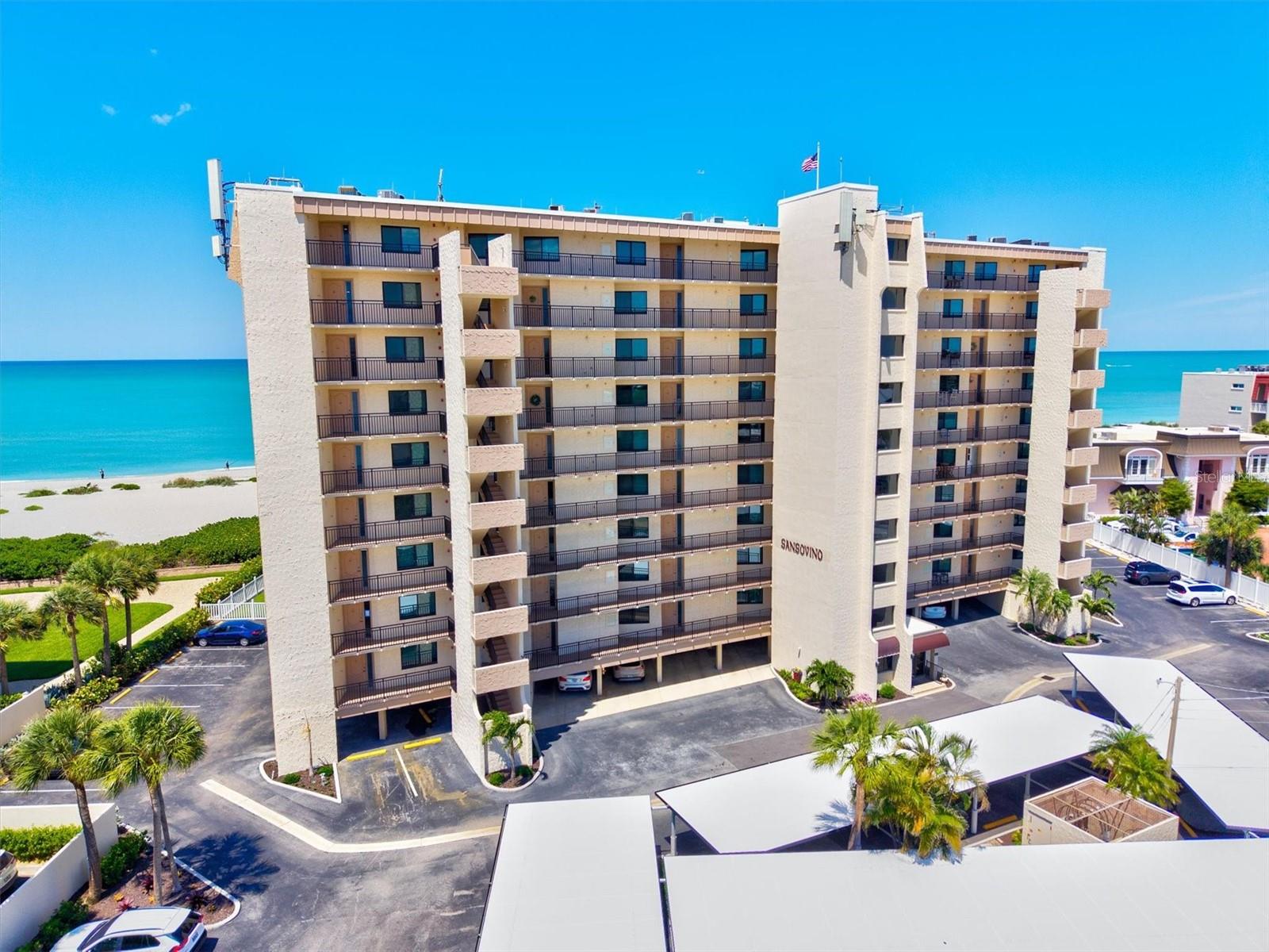 This beautifully renovated and upgraded 1st-floor elevated condo in the highly sought-after Sansovino on Venice Island offers spectacular views of the Gulf and Venice Beach. As a desirable end unit, the residence is filled with natural light and showcases stunning coastal scenery from multiple vantage points.

Completely updated with quality finishes throughout, this condo features tile flooring throughout, crown molding, and custom millwork accents that add character and sophistication. The open-concept living space flows seamlessly to the spacious lanai, where motorized shades allow you to relax and take in the breathtaking views year-round.

The kitchen is thoughtfully designed with upgraded cabinetry, granite countertops, and quality appliances, creating a functional and inviting space for everyday living and entertaining. The living and dining areas offer a bright, airy feel that complements the coastal setting.

The primary suite provides a peaceful retreat with beautiful views, ample closet space, and an updated en-suite bath. The guest bedroom is well-appointed and ideal for visitors, complemented by an updated guest bath featuring a tiled shower.

Additional highlights include hurricane impact windows, a whole-condo water filtration system, and numerous upgrades throughout. A convenient on-site storage closet is also available for residents.

Sansovino offers secure access, elevators, a clubhouse, heated pool, private beach access, and a barbecue area for residents to enjoy. Located just minutes from downtown Venice, dining, and shopping, this is an exceptional opportunity to own a fully updated Gulf-front condo.