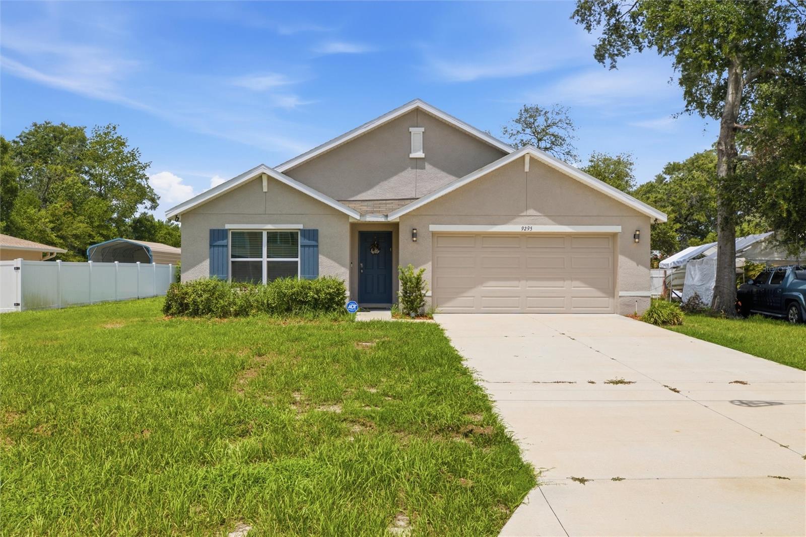 Welcome to this stunning 2023-built, all concrete block home offering 4 bedrooms, 2 bathrooms, and 1,828 sq ft of thoughtfully designed living space. The open-concept layout features a spacious kitchen that flows seamlessly into the living and dining areas perfect for entertaining. The kitchen is fully equipped with refrigerator, dishwasher, electric range, and microwave. Step outside to your covered lanai for relaxing Florida evenings. The private primary suite is tucked at the back of the home and features its own en-suite bathroom. Three additional bedrooms and a second full bath. This home also includes a laundry room and the a washer and dryer included! Single-story living and move-in ready feel.