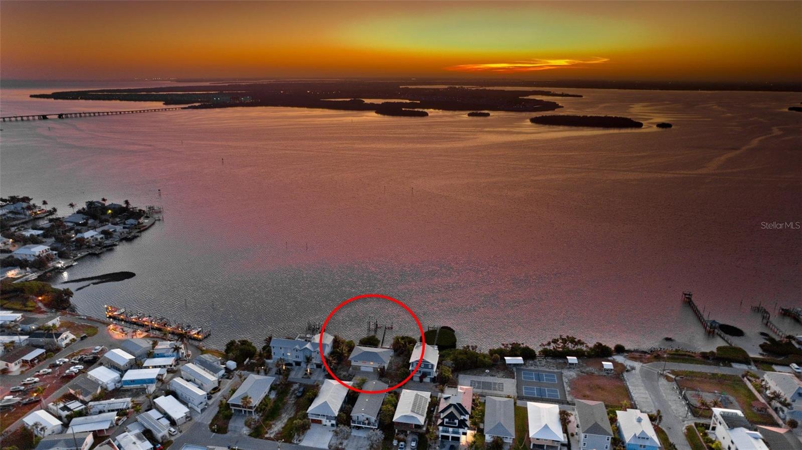CONFIRMED POTENTIAL FOR TWO BUILDABLE WATERFRONT LOTS - This rare offering features nearly 100 feet of direct bay frontage in the heart of Bradenton Beach, where expansive open-water views stretch from sunrise to sunset.

A 75-foot composite dock (2019) with a 4,500 lb. boat lift (2014) extends into the bay, creating an ideal setting for boating, fishing, or simply unwinding as the water shifts with the light throughout the day. The existing residence is original and centrally positioned on the parcel, presenting a clear opportunity for redevelopment.

Whether envisioning a private bayfront estate or two distinct luxury homes, the property offers flexibility supported by its exceptional lot width, depth, and unobstructed views. 

Surrounded by high-end new construction, this location continues to prove its long-term value. Opportunities with this combination of frontage, development potential, and setting are increasingly limited on Anna Maria Island.

From quiet mornings on the dock to the stillness of the bay at dusk, this is a property that offers both a place to build and a reason to stay.