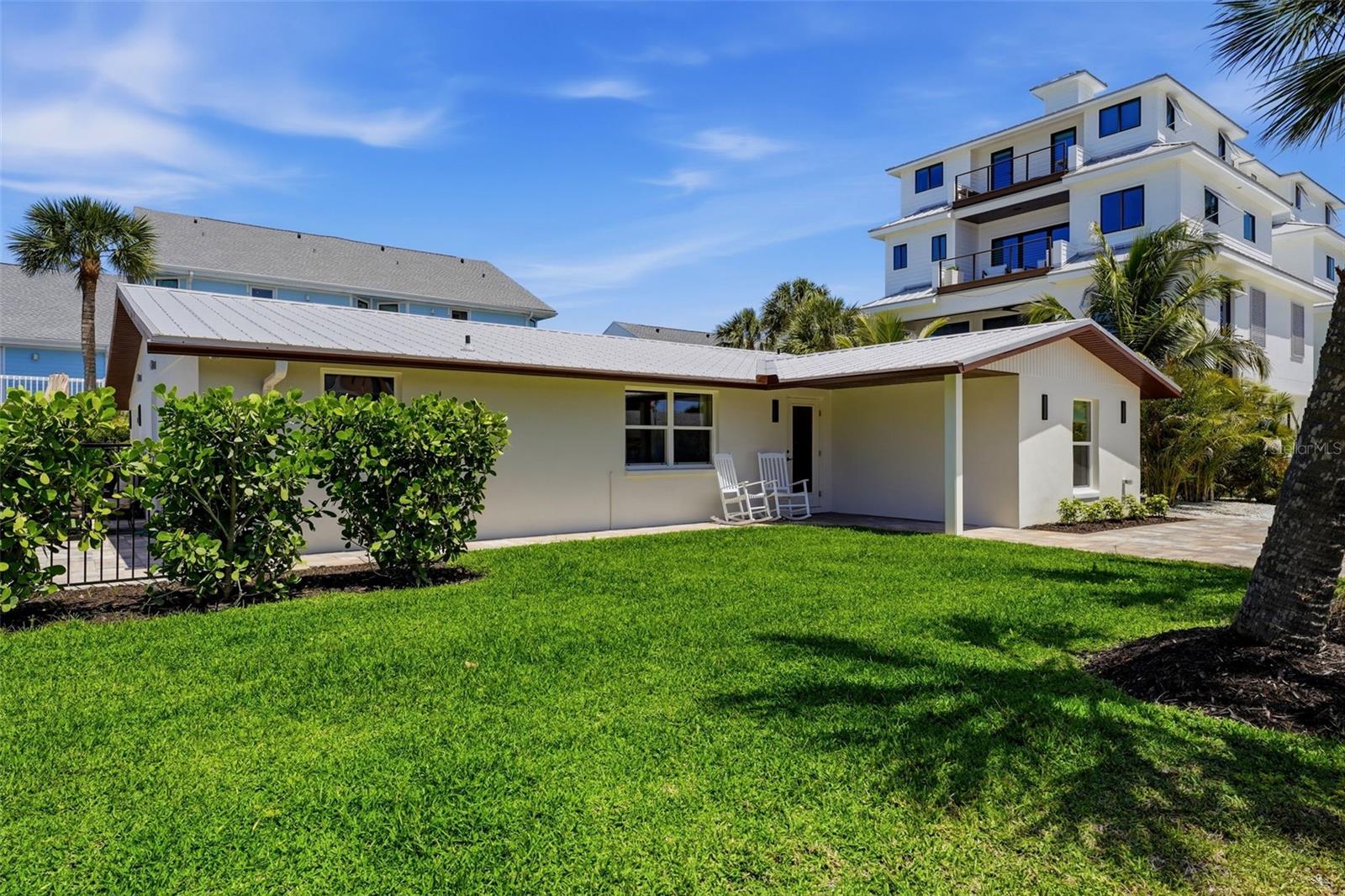 $100,000 PRICE IMPROVEMENT – NOW OFFERED AT $1,100,000! This is your opportunity to own what is believed to be the ONLY home on the market located on the south end of Manasota Key offering the highly coveted combination of DEEDED BEACH ACCESS, TWO PRIVATE BOAT LIFTS, and a BRAND-NEW HEATED & COOLED SWIMMING POOL. Perfectly positioned on the popular south end of the Key, you'll enjoy walking distance to restaurants, bars, live entertainment, shopping, and the beach, making this one of the most desirable locations on the island. Whether you're searching for a luxury vacation retreat, a high-performing short-term rental investment, or a full-time waterfront residence, this property offers unmatched versatility. Located in one of Manasota Key's most sought-after vacation rental areas, the home benefits from NO HOA and NO RENTAL RESTRICTIONS, allowing owners the flexibility to maximize rental income while still enjoying the property whenever they choose. Recently reimagined from the ground up and now professionally furnished and decorated, this stunning coastal home is truly move-in ready. The thoughtfully redesigned floor plan showcases luxury finishes throughout, including a designer kitchen with a large island, stone countertops, brand-new stainless-steel appliances, and spacious living areas designed for entertaining and relaxed island living. The split-bedroom layout offers privacy for owners and guests alike. The spacious primary suite features a luxurious bath with dual vanities and a walk-in shower, while two additional guest bedrooms and bathrooms provide comfortable accommodations for family and visitors. Step outside and experience your own private resort. The brand-new 24' x 12' heated and cooled swimming pool allows year-round enjoyment, while ambient lighting, shade sails, wrought iron fencing, and mature landscaping create an inviting outdoor oasis. Wiring is already in place for a future hot tub and cold plunge. Boaters will appreciate the deeded dock access on Lemon Bay featuring TWO PRIVATE BOAT LIFTS with water and electric service. From here, enjoy direct boating access to the Gulf with no fixed bridges. Just across the street, deeded beach access leads to a quieter stretch of Gulf shoreline where you can enjoy morning walks, shelling, and breathtaking sunsets. Major upgrades include impact windows and doors, metal roof, all-new electrical with 200-amp service, all-new plumbing, new HVAC system and ductwork, closed-cell spray foam insulation, new paver driveway and walkways, and a new irrigation system supplied by an on-site well. Opportunities like this are exceptionally rare. Finding a property with beach access, bay access, TWO boat lifts, a heated and cooled pool, no rental restrictions, and a walkable location in the heart of Manasota Key's most vibrant area is nearly impossible. Schedule your private showing today and discover why this is one of the best values currently available on Manasota Key.