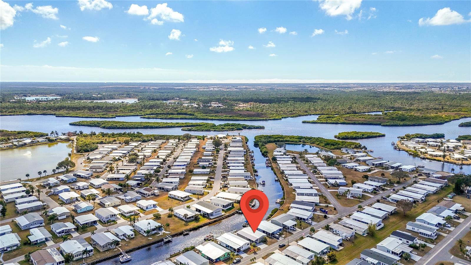 Under contract-accepting backup offers. Price REDUCED! Don’t miss this FURNISHED CANAL-FRONT home with a PRIVATE DOCK in a sought-after 55+ community along the Myakka River. One of only a few canal-front homes currently available—and the only one with a private dock currently listed on the MLS—this property offers direct boating access to the Myakka River, which leads all the way to the Gulf, ideal for exploring scenic waterways and fishing. Originally 960 sq. ft., this 2-bedroom, 2-bath home in the pet-section, now offers approximately 1,190 sq. ft. of living space with the enclosed lanai creating a bright waterfront living area. The open floor plan features a white kitchen updated in 2021 with modern appliances, backsplash, and island seating. Additional upgrades include impact windows and new siding (2022), drywall walls and ceilings, as well as updated flooring. The primary suite includes a private bath, while the guest bedroom and second bath provide comfortable space for visitors. Major improvements also include a new vapor barrier and ductwork, water heater, and an epoxy-coated driveway and patio. Enjoy the canal-side patio—perfect for relaxing, entertaining, and taking in the wildlife and water views. A large 24' x 13' storage shed and wide driveway add extra convenience. HOA fee of $175/month includes access to two heated pools, spa, fitness center, various sports courts, and an active clubhouse overlooking the marina—an ideal backdrop for dances, parties and other social events. Located close to beaches, golf, dining, shopping, and medical facilities, this move-in ready waterfront home offers a great way to enjoy the Florida lifestyle. Easy to show—schedule your private showing today.
