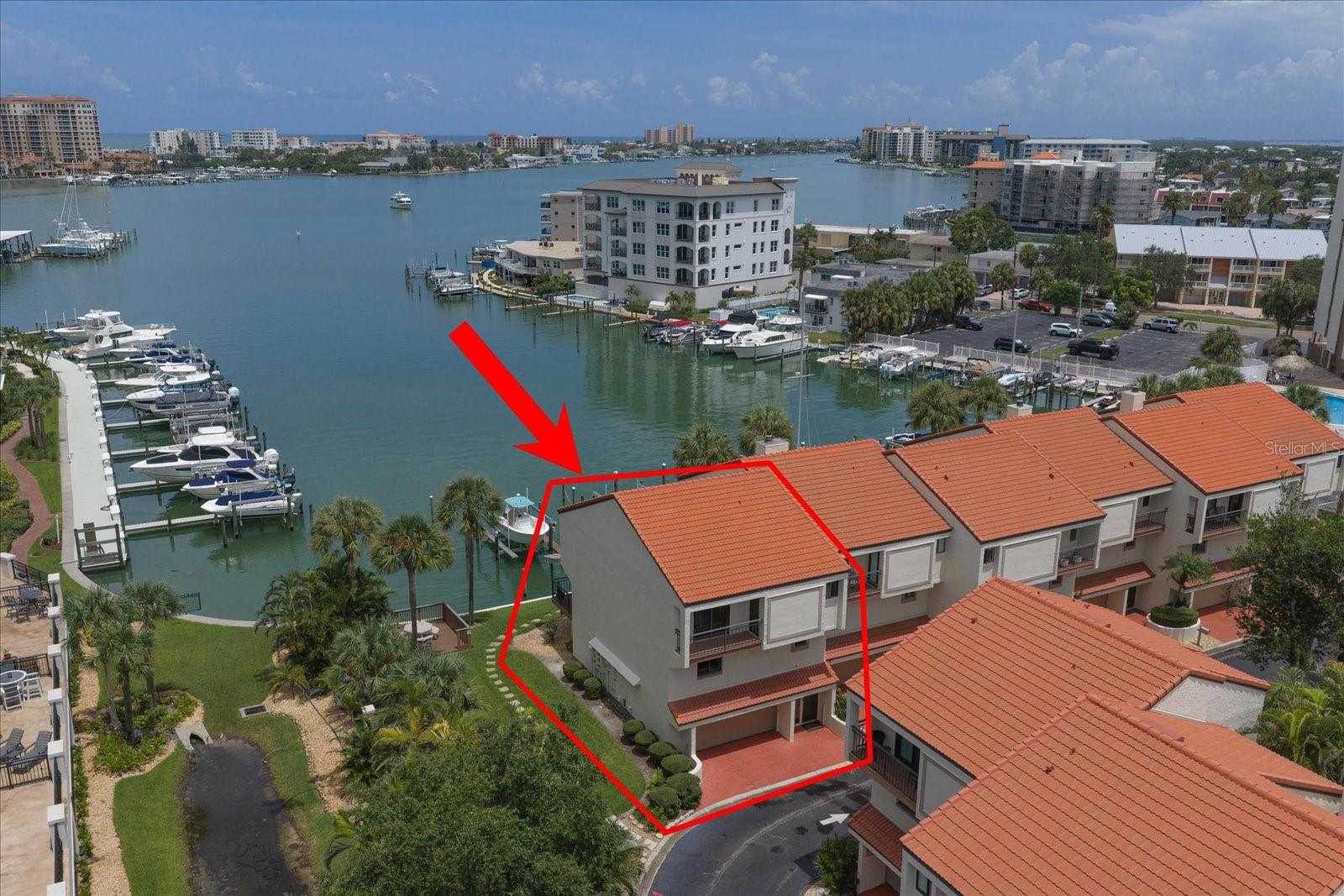 Welcome to coastal luxury living in the highly sought after Island Estates! This stunning, fully renovated 3 bedroom, 2.5 bathroom townhome offers the perfect blend of modern elegance, comfort, and convenience just minutes from world-famous Clearwater Beach.
Thoughtfully redesigned from top to bottom, this light-filled residence showcases a sophisticated coastal modern aesthetic with high-end finishes throughout. The spectacular custom kitchen features premium cabinetry, smart appliances, sleek countertops, a dramatic waterfall breakfast bar, additional bar ice machine, beverage refrigerator and is ideal for both everyday living and entertaining. The spacious open concept floor plan is enhanced by top-of-the-line electronic blinds, designer lighting, and beautifully updated bathrooms. Being offered fully furnished, this turnkey home is ready for immediate enjoyment. The oversized 3 car garage features an epoxy-coated floor, an electric vehicle charging station, additional storage room providing exceptional convenience. Enjoy the Island Estates lifestyle with two community swimming pools, beautifully maintained grounds, and boat slips available for rent, making it easy to enjoy the surrounding waterways. This end unit is perfectly positioned along a wide deep water canal with amazing views, sunsets and the Gulf breeze from your private outdoor living space. Whether you’re heading out by boat, walking to nearby restaurants, visiting the Clearwater Marine Aquarium, or spending the day on the sugar sand beaches of Clearwater Beach, everything you need is just moments away. This exceptional home offers the perfect combination of style, location, and move-in-ready convenience.  Flood Barrier Protection Included!