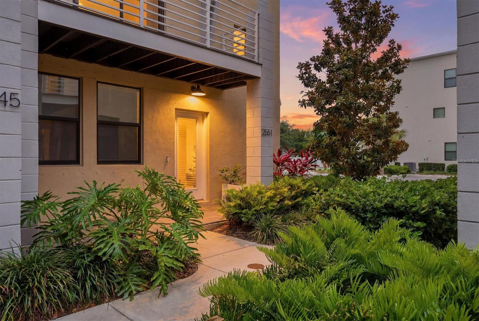 Welcome to one of the largest and most desirable floor plans available in the gated community of Uptown Kenwood! Built in 2020, this beautifully appointed end-unit townhome offers 4 bedrooms, 3.5 bathrooms, and a 2-car garage, combining modern design with an unbeatable location just minutes from downtown St. Petersburg and the iconic St. Pete Pier. The open-concept main living area is perfect for entertaining, featuring abundant natural light and seamless flow between the living, dining, and kitchen spaces. The chef-inspired kitchen is equipped with stainless steel appliances, a double oven, quartz countertops, 42-inch shaker-style cabinetry, and a separate bar area complete with a wine refrigerator. Step outside to the private second-floor balcony overlooking the community courtyard and pool, creating the perfect space to relax and unwind. The spacious primary suite features custom closet built-ins by Closets by Design and a luxurious en-suite bathroom with dual vanities and a large walk-in shower. Additional bedrooms provide flexibility for guests, a home office, or growing households. Residents of Uptown Kenwood enjoy resort-style amenities, including a community pool, fire pit gathering area, and gated entry for added privacy and peace of mind. Don’t miss this rare opportunity to own a premium end-unit townhome in one of St. Petersburg’s most convenient locations, close to dining, shopping, entertainment, and waterfront attractions.