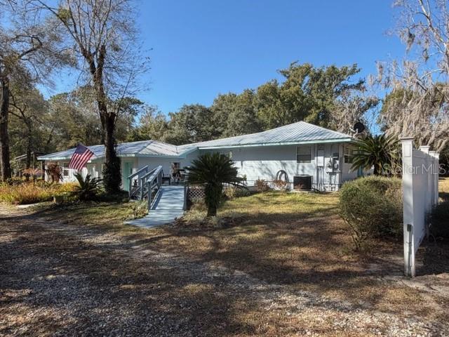 Private 6.07 Acres of Pristine Wooded Property with a huge 48 x 40 1,920sf Shop Building with 100 Amp Electric Service 16' ceilings space for a lift, and full bath room, a 44 x 38 1,760sf RV and Boat Pavilion Carport for a Class A RV and a 42' boat, 24 x 20 ADU In Law Building with Private Entrance, 3 other small Outbuildings, Fenced Pasture, Beautiful 2 Bedroom 2 1/2 Bath home with Private Office, Well Appointed, Spacious with an Open Floor Plan with the Kitchen, Breakfast Room and Family Room all open, 2 Primary Suite Bed Rooms, Inside Laundry Room, 1 Car attached Garage, No HOA, County maintained Road, Great Proximity to the 429 Wekiva Parkway leading to I-4 and the 417 Expressway, a Truly Beautiful Home in the country with convenience to shopping, restaurants, Mount Dora, and Sanford.