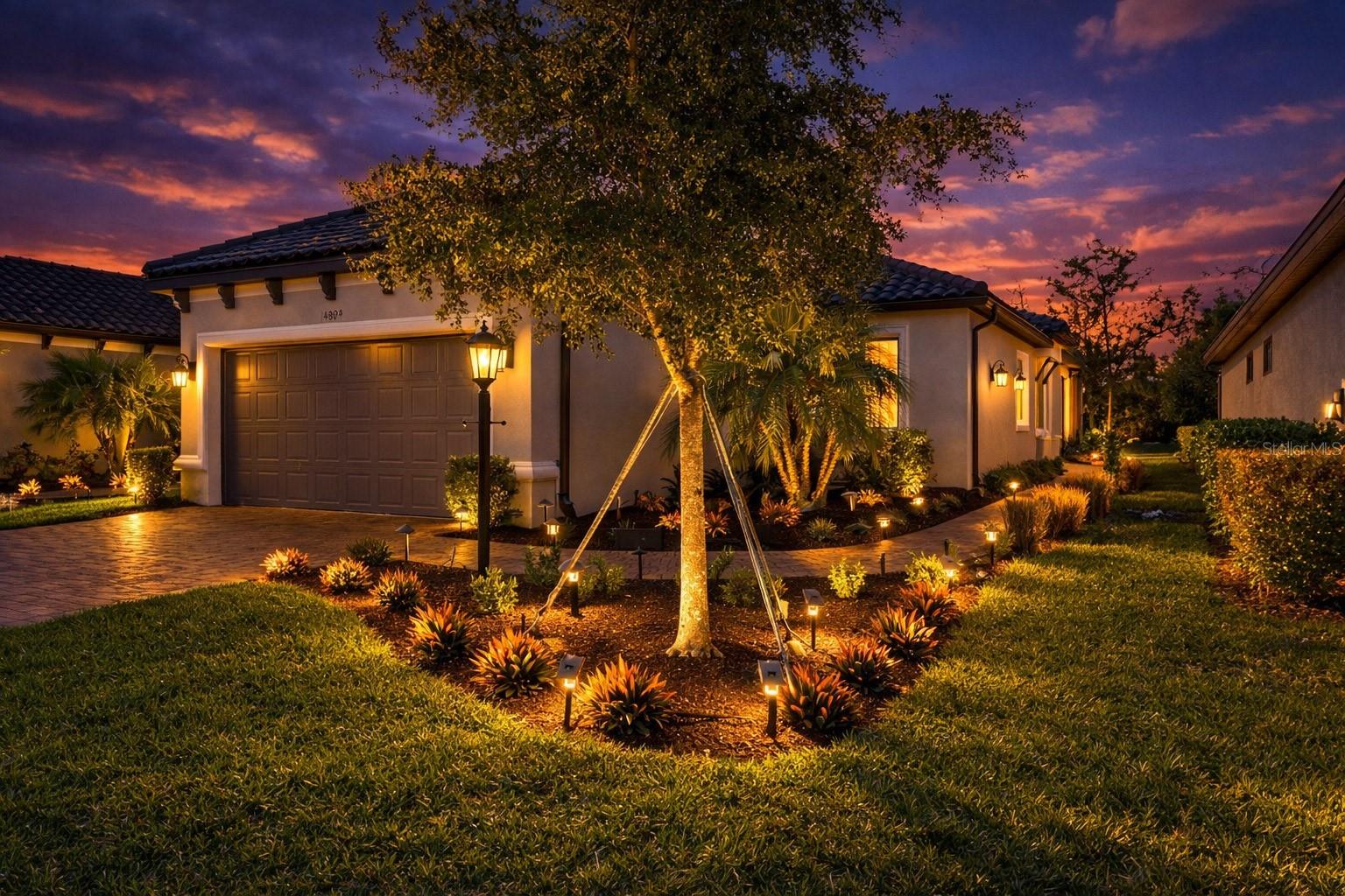 GOLF DEEDED · GAS-HEATED POOL & SPA · WHOLE-HOUSE GENERATOR · AMAZING NEW PRICE OF $669,000 — THIS IS THE ONE YOU'VE BEEN WAITING FOR! A deeded golf membership AND a gas-heated pool home under $675,000 in Esplanade at Azario is genuinely rare — and this one is move-in ready. This property also qualifies for a 1% lender credit when using our preferred lender — inquire for details.
Live the resort lifestyle every single day in this beautifully appointed Roma floor plan in one of Lakewood Ranch's most coveted gated communities. Professionally designed illuminated landscaping on three sides sets the tone for the exceptional quality found throughout.
Offering 2 bedrooms plus a den, 2 baths, and 1,689 square feet of thoughtfully designed living space, this residence blends comfort, elegance, and privacy. A private side entry opens to a bright open-concept layout where wood-look plank tile flows seamlessly through the main living areas, complemented by upgraded lighting, ceiling fans, 8-foot doors, pocket doors, and a floor outlet for flexible furniture placement. The designer kitchen features GE Café stainless steel appliances including a gas range and French door refrigerator with hot water dispenser, quartz countertops, tile backsplash, New Haven cabinetry with soft-close doors and drawers, under-cabinet lighting, pull-out shelving, and a spacious pantry. A peaceful primary suite featuring a bay window, walk-in closet, dual vanities, frameless glass shower enclosure, and private water closet. The den offers a transom window for added natural light, while the secondary bedroom and full bath are positioned for maximum guest privacy. THE OUTDOOR OASIS: The extended paver lanai showcases a gas-heated pool and spa with a powerful 400K heater upgrade, programmable multicolor pool cage lighting, and a natural gas connection for outdoor grilling. Recent upgrades include whole-yard soil and sod enrichment, new professional landscaping, and refreshed interior paint — truly move-in ready.
PEACE OF MIND: The 24kW Generac whole-house generator with 7-year extended warranty ensures you are never without power. Additional highlights include a hurricane-impact glass front door with sidelight, extended garage with epoxy flooring, attic pull-down stairs, laundry room with cabinetry and sink, and paver driveway.
THE COMMUNITY: Your included Premier Golf Membership grants access to the 18-hole championship course, Aqua driving range, and pro shop — along with the Bunker Bar, resort-style pool with Bahama Bar, full-service spa, culinary center with teaching kitchen, Barrel House Bistro, Olive & Vine cafe, fitness center, tennis, pickleball, bocce, dog parks, walking trails, and a full-time activities director. Maintenance-free living with lawn care included by the HOA.
Play golf in the morning, relax poolside in the afternoon, and enjoy dinner at the culinary center in the evening — all without leaving your community.
Schedule your private showing today — opportunities like this do not last.