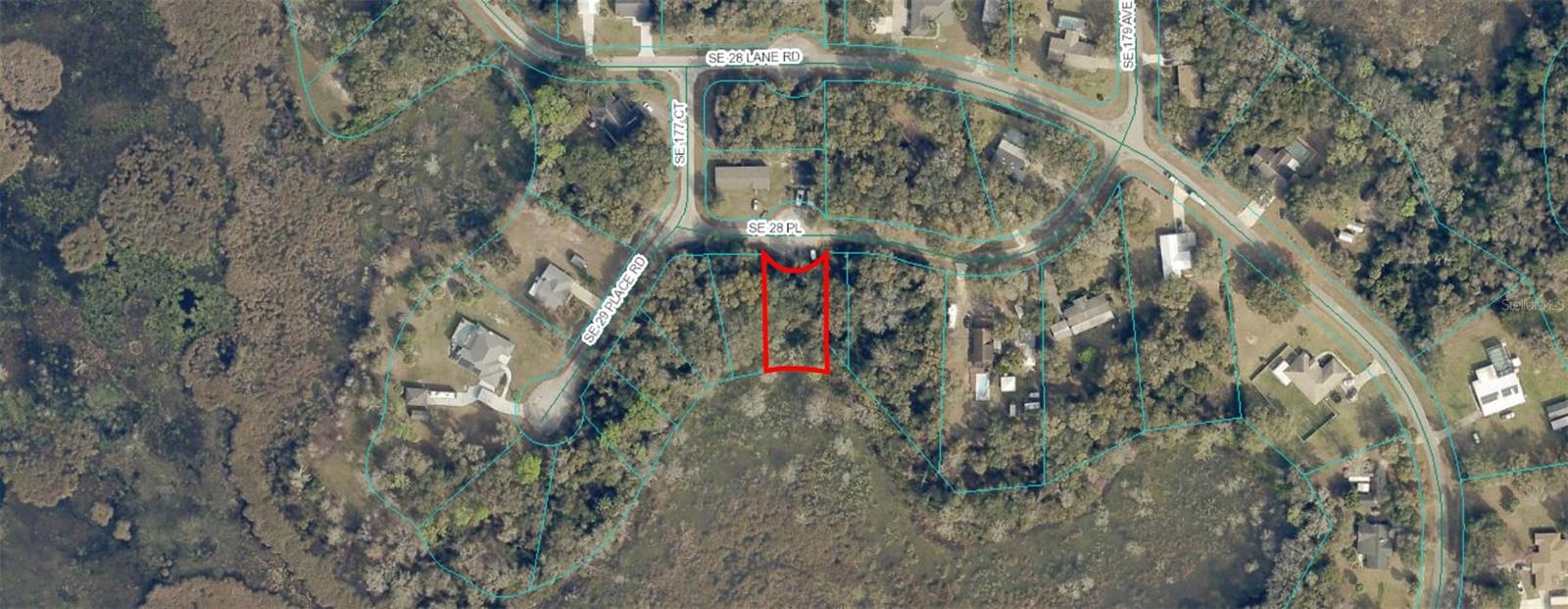 LOCATED IN LOVELY SILVER SPRINGS WOODS. WONDERFUL LOT ON A PAVED STREET, HIGH AND DRY WHERE THE HOME WILL GO. ON NORTH LAKE BRYANT. AWAY FROM CITY AND MIXED USE. MOBILES OR SITE BUILT HOMES OK.