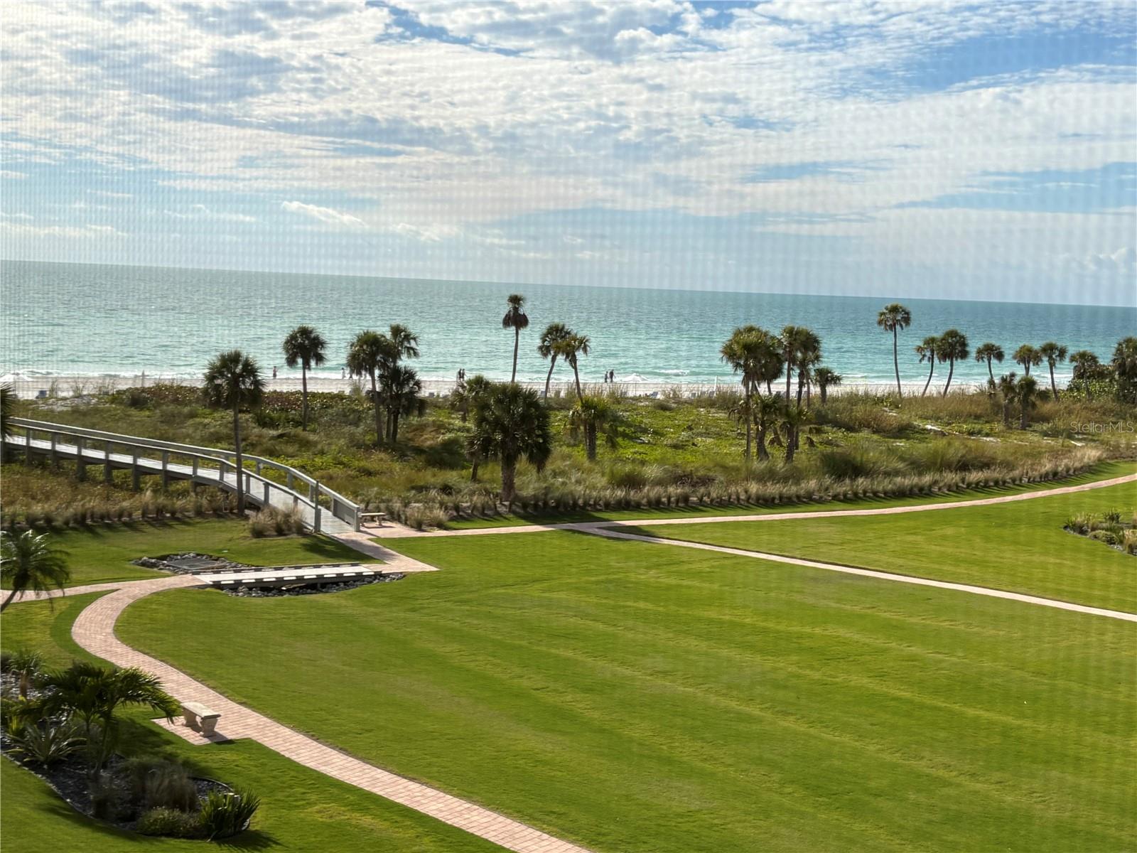 Enjoy the best of Gulf-front living in one of the largest units, this 3-bedroom, 3-bath residence with a flexible study/den/4th bedroom, in a gated community located on the sought-after south end of Longboat Key. This residence offers sweeping views of the Gulf of Mexico and includes an enclosed lanai with new telescopes, hurricane windows, and a spacious interior with tile floors in the main living areas and a neutral color palette. A wall of sliding glass doors in the living room opens to a spacious enclosed terrace—perfect for relaxing, dining, and enjoying the sounds of the surf through the new telescoping hurricane windows. The kitchen is large enough for all the chefs in the family. Corian countertops, a tile backsplash, and a breakfast bar that connects easily to the living space. The primary suite includes a king-size bed, wake up to view of the Gulf, access to the terrace, and an en-suite bath with a large walk-in shower. For your guests, the second bedroom has an en-suite bathroom. The third bedroom provides a great space for guests or a home office. The private terrace offers views of the beautifully maintained grounds, the beach, and the Gulf beyond. The Players Club elevates coastal living with resort-style amenities, including a beautifully updated clubhouse featuring a state-of-the-art fitness center, social and catering spaces, four Har-Tru tennis courts, 4 Har-Tru pickleball courts, a putting green, and a heated saltwater pool and spa. Players Club is located just a short drive to St. Armands Circle, where you will enjoy the shopping and dining experiences. Just over the Ringling Bridge, there are many theater options downtown Sarasota. Additional conveniences include on-site management and a 24-hour staffed gate, ensuring comfort and peace of mind.