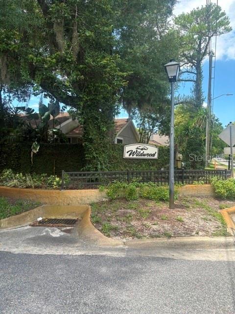 Enjoy easy living in this beautifully maintained townhome.  Ideally located in the sought-after Wildwood community in Winter Springs. This home features 2 bedrooms and 2 bathrooms, freshly painted interior and new blinds in the living room. Tile floors throughout make cleaning a breeze. Enjoy sitting out on the screened in lanai with your favorite beverage. The spacious primary suite serves as a private retreat, complete with a wall closet, and a walk-in closet, and an en-suitebathroom. The well appointed kitchen offers ample cabinetry and counter space and flows seamlessly into the dining and living areas.  Residents enjoy access to a variety of community amenities, including a swimming pool, tennis courts, playground and clubhouse.  Conveniently located with easy access to major roadways.  This home makes commuting throughout Central Florida simple while allowing you to enjoy a charming lifestyle in a prime location.