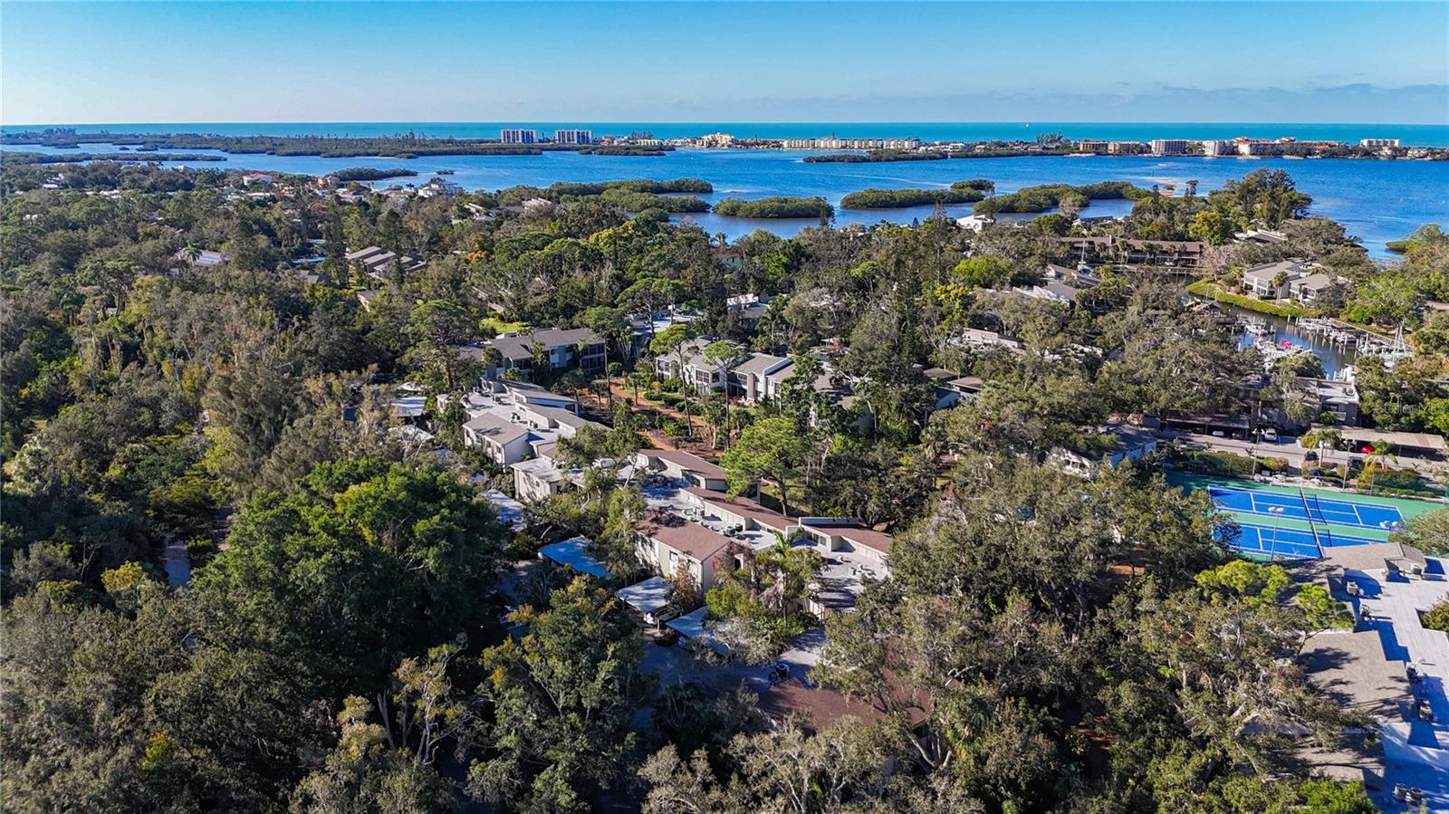 Beautiful 2 Bedroom/2 Bath on 2nd floor right around the corner of Wilbanks and Harbor Club. Owner upgrades in 2017 include complete kitchen renovation, including appliances, new flooring, ceiling fans, lanai rescreening, electrical panel and whole house surge protector, window treatments, hardwired smoke detectors. Tub/Shower combination in both bathrooms. Pelican Cove is a 75-acre, gated, vibrant-waterfront community nestled among manicured tropical foliage. Truly offering something for everyone. Abundant amenities include the 86-slip boat harbor with excellent rates & a launch dock for kayaks and canoes, 6 heated swimming pools, hot-tub, 3 clubhouses, lighted tennis/pickleball courts, basketball, dog walk area, walking trails and boardwalks, as well as fishing gazebos, water exercise classes, exercise facility, 2 art studios and a pottery classroom. Take classes at Pelican Cove University or join one of the more than 37 clubs/groups for photography, fiber art, bike riding, culinary arts and card clubs. Woodworking, sculpting, and evening jazz & classical music concerts round out the active lifestyle. Come and see what you have been waiting for.