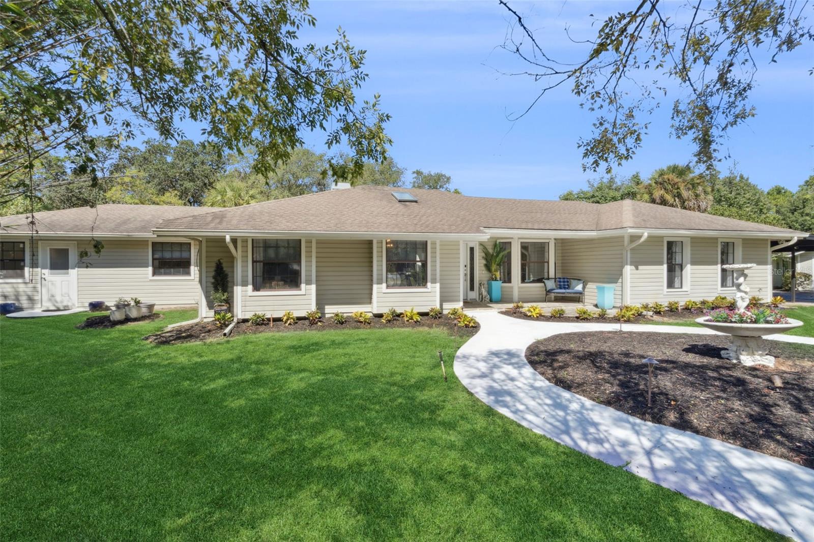 Designed for both comfort and style, this unique retreat, nestled on 1.2 acres in the prestigious Markham Woods corridor, offers the perfect blend of privacy, comfort and functionality - featuring a 2800 SF Main Home and an 880 SF Guest House for multi-generational family living. The property has an unbeatable location - just minutes from I-4, SR-429 and SR-417. Families benefit from the area’s employment opportunities and great schools - while outdoor and sports enthusiasts will love numerous activities including golf, tennis and soccer, plus miles of preserved scenic walking and biking trails as well as the nearby Wekiva and St. John's River preserves. As you enter the property via a private driveway, you’ll find a serene and inviting atmosphere, while an oversized 2-car garage, a 2-car carport, and spaces around the entire driveway provide ample parking arrangements. There is also a separate shed and storage room and, with NO HOA restrictions, you're free to bring your RV, boat or trailer! Once inside the 3BR 2BA 2800 SF Main Home, you’ll discover a thoughtfully customized home boasting an open and bright layout - featuring vaulted ceilings over a spacious great room and dining room, an open kitchen equipped with a large pantry and upgraded appliances including gas cooking, a customized bar lounge for entertaining leading to a beautiful Florida room to bring the outdoors in, a separate large office/den with an abundance of cabinetry, and a fully equipped laundry room with custom storage. In addition to the Main Home, the separate 880 SF Guest House provides a complete and perfect home for visitors, parents, extended family, or for rental income. This charming Guest House features one-bedroom, one-bathroom, living area, open kitchen with a four-seater island, and an outdoor deck overlooking a reserve area separate and private from the Main House. The Guest House also features additional “flex” living space for a study, second bedroom or even a nursery! The deed also includes Lot 9A according to the Seminole County records, for a total of 1.2 acres. With its location and with every detail carefully considered, this property is a rare find waiting for the perfect family. Don’t miss the opportunity to experience this unique home. Call us today for your private tour!