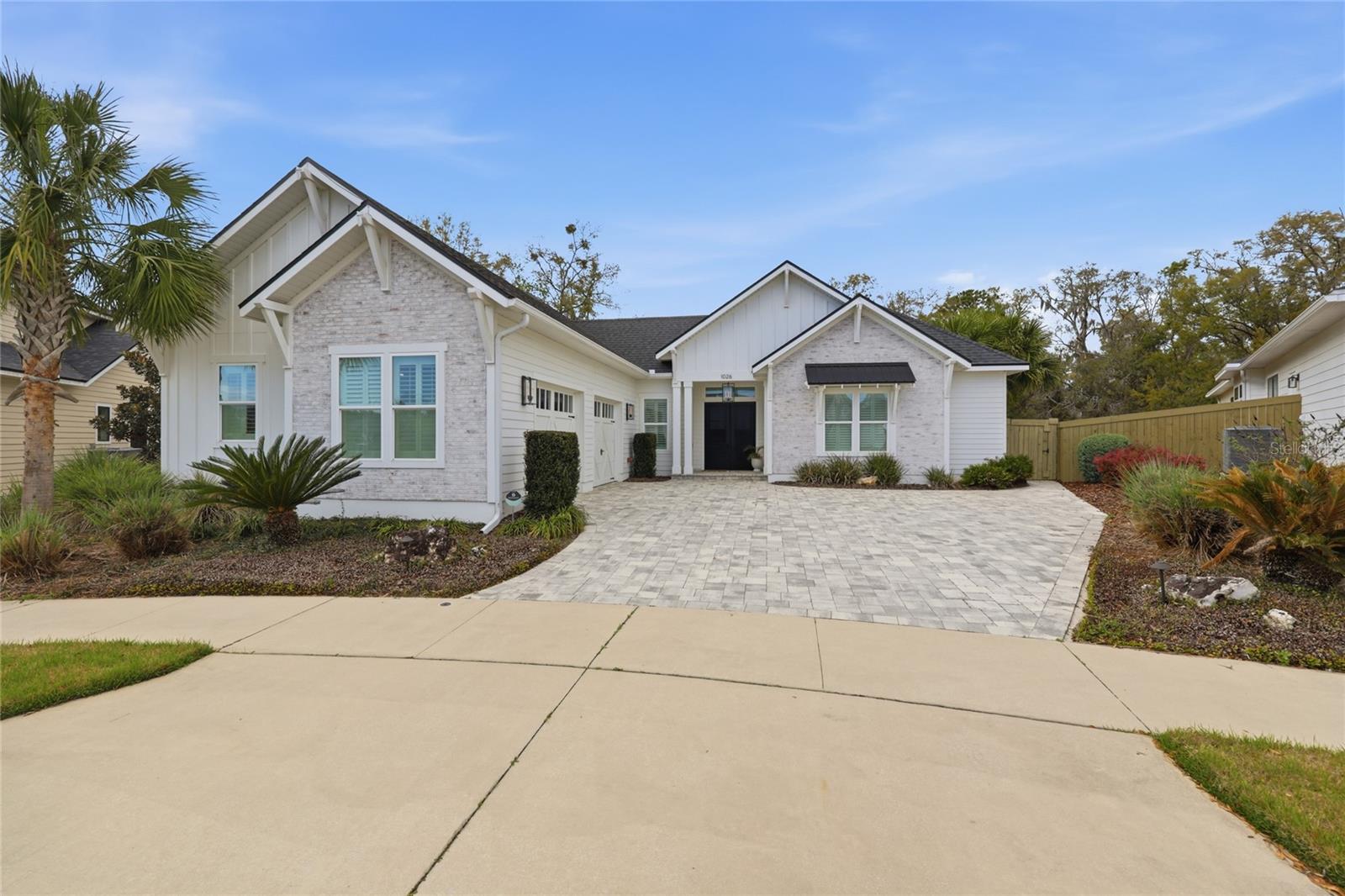 Welcome to this exceptional 2019 Pridgen Parade Home, a true courtyard estate located in the sought-after community of Gloria’s Way—where luxury design and resort-style living converge.

Beyond the double front doors, you are immediately welcomed into a stunning private courtyard oasis featuring a pool and spa, multiple water features, mature palms, and expansive seating areas designed for both relaxation and entertaining. An outdoor fireplace and Big Green Egg grilling station anchor the space, while a private rear yard access and outdoor shower further enhance the indoor-outdoor lifestyle. A fully detached one-bedroom, one-bath casita offers ideal flexibility for guests, a private office, or multigenerational living.

The main residence offers 4 bedrooms and 3.5 baths with a seamless open-concept design. Multiple glass doors invite natural light and provide effortless flow between the interior living spaces and the courtyard. At the heart of the home is a designer kitchen featuring a dramatic quartz island, KitchenAid double ovens, a six-burner gas cooktop with pot filler, soft-close cabinetry with illuminated glass uppers, open shelving, and a side-by-side Frigidaire Professional refrigerator and freezer. A spacious walk-in pantry completes the space, designed for both everyday living and elevated entertaining.

The kitchen transitions seamlessly into the dining area and expansive living room, where custom built-ins, a gas fireplace, and a beverage center with wine refrigeration create a refined yet comfortable gathering space.

The thoughtfully designed three-way split floor plan ensures privacy, with each bedroom enjoying convenient access to its own bath. The owner’s retreat is a private sanctuary with direct courtyard access, its own fireplace, dual walk-in closets, and a spa-inspired ensuite featuring a steam, sauna, and multi-head shower system, dual vanities, and a freestanding soaking tub.

Additional highlights include a fully integrated smart home system controlling lighting and key home functions directly from your phone, along with numerous upgrades that elevate both form and function throughout the property.

Offered fully furnished and turnkey, this residence presents a rare opportunity to step immediately into a curated luxury lifestyle—ideal as a primary residence or executive retreat.