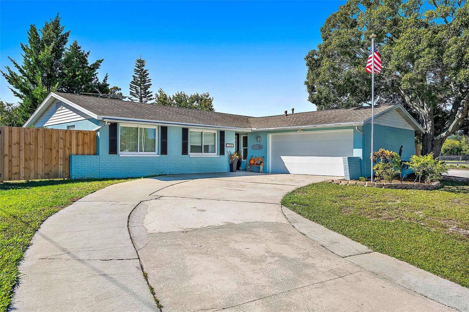 High and dry in Flood Zone X with no flooding during the 2024 hurricanes and no HOA/CDD fees! This warm and cozy home is so convenient to world-class beaches, dining, shopping, top-rated schools and so much more. The kitchen is equipped with stainless steel appliances including a propane gas range, and offers extraordinary cabinet and counter space for cooking and entertaining. Versatile dining options include both a formal dining room and a breakfast nook off the kitchen. Two bonus rooms make this home even more inviting if you need a home office, workout room, etc. The secluded back yard is fully fenced with a small deck, plenty of room for grilling out and a spacious shed equipped with electrical service. Upgrades include new flooring, newer wood fencing, newer garage door & opener and 4 new well points for irrigation in 2024. This awesome neighborhood includes privileges at the Seminole Recreation Center directly across the street.
