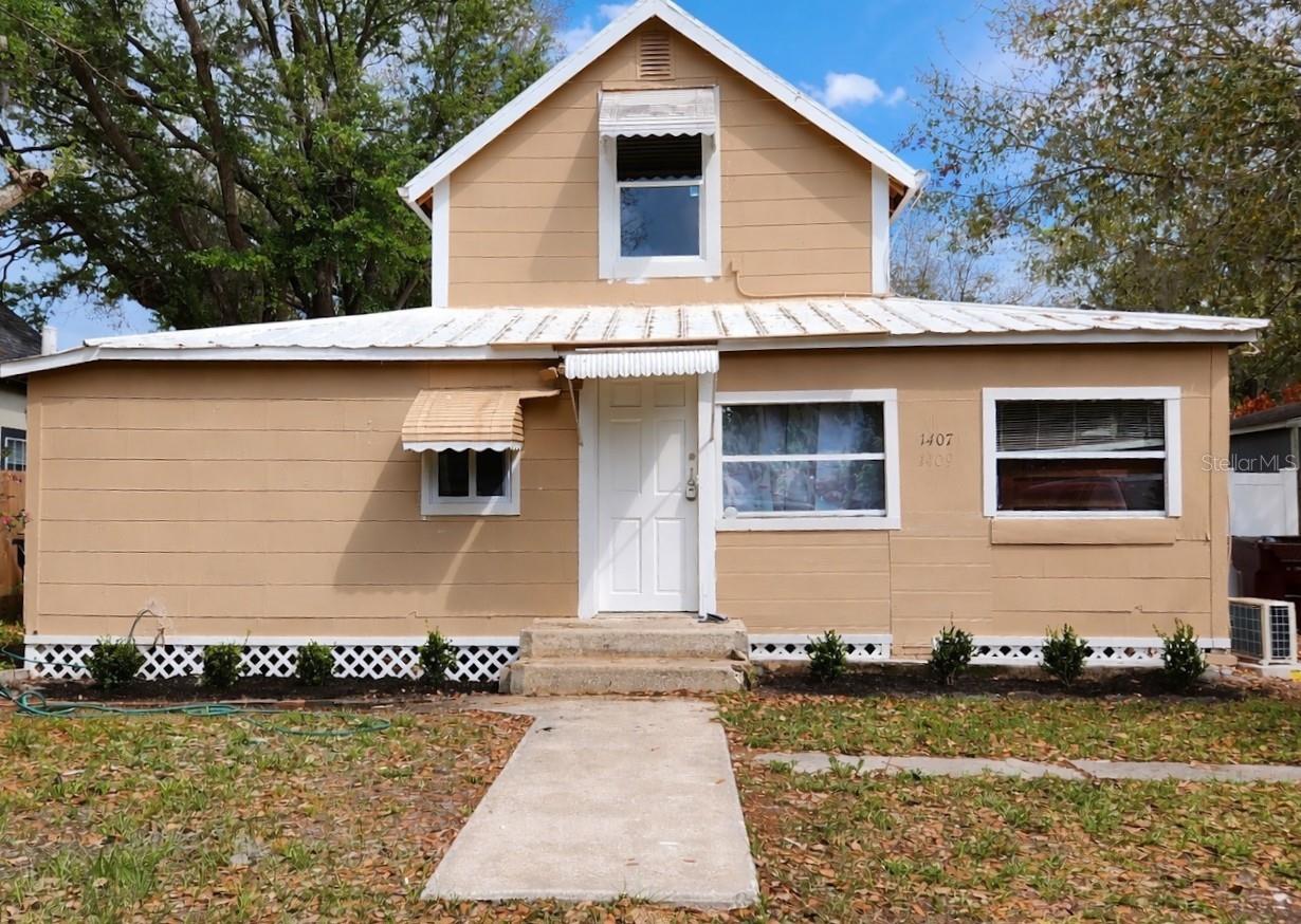 SELLER MOTIVATED. BRING ALL OFFERS!  Location, location, location!!! This duplex home is situated in a beautiful neighborhood only one block from the main highway, and is priced to sell.  Currently designed into two residences, this is a great investment opportunity, or make it your home and rent out the 2nd residence.   In the two-story main (front) residence, there is one bedroom and a bath downstairs and there are two bedrooms upstairs. The main kitchen is spacious enough for a table and chairs, and the living room is large and inviting. The owner has made a significant investment in renovations completed to date. Updates include new subfloors and leveling, luxury vinyl tile throughout both residences (excluding front apartment kitchen and rear apartment bath) and new HVAC AC (Ductless/mini-split) in both residences, with 3 compressors and 7 interior wall units. 

The Main residence is approximately 1030 SF and is a 3/1, and is ready to move in.  The main residence updates include new windows, doors, bathroom sink, lighting and cabinet, baseboards, drywall, floors, paint, newly built staircase.  The outside of the main residence has been cleaned, repaired and landscaped.  The roof has been cleaned, repaired and painted.  No leaks!  For the rear residence, a 2 bedroom 1 bath that is approximately 454 SF, see photos of unfinished/unrepaired (except for LVT on floors and HVAC ductless mini-split units which have already been installed) walls and windows.  It has its own separate entrance, kitchen and bath.   There are 5 new windows already purchased that buyer can have installed.  Exterior of the home has been painted.  Lattice around bottom of entire home has been installed.  There is a large, completely fenced back yard with a large storage shed (needs removal of overhang, but otherwise sturdy building). The yard is very private and is a great place to cook out or just hang out. There is plenty of room for a playset or playhouse, or even a pool! This property has so many options! Renovate to reside in the entire home, live in the front 2 story residence and renovate to rent out the back residence or use the back as an In Law Suite with its private entrance, or finish the renovation in the back residence and rent out both the front and the back!! This is a great investment for a homeowner or an investor. Property is close to some great amenities, including Disney and major theme parks, a local beach, park and quaint downtown just a few blocks away. It is a short distance to shops, schools and restaurants…including the locally famous Fat Boy's BBQ with salad bar, The Cup Diner, Crabby’s on the Lakefront and the local favorite The Catfish Restaurant.