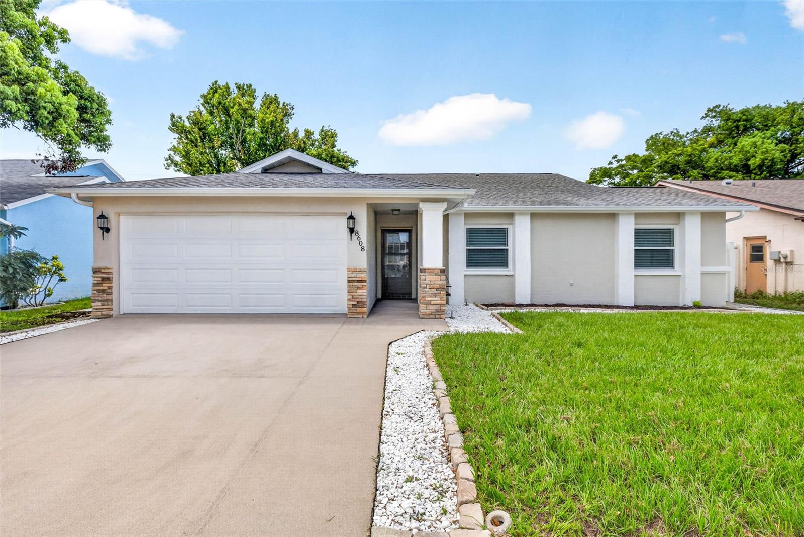 Under contract-accepting backup offers. Exceptional craftsmanship and thoughtful design define this beautifully renovated 3-bedroom, 2-bath, 2-car garage home, complete with a NEW 2026 roof, NEW 2026 A/C system, NO HOA, and a versatile Flex Room.

From the moment you arrive, you’ll appreciate the outstanding curb appeal, highlighted by a premium decorative stone-finish driveway and matching garage floor, creating a distinctive custom finish that combines beauty with lasting durability. 

Step inside to a bright, open floor plan featuring elegant Carrara marble-look tile throughout the living room, dining room, and kitchen, complemented by luxury vinyl plank flooring in all bedrooms. Designer finishes and a timeless neutral color palette create a warm, inviting atmosphere throughout.

Designed for both everyday living and entertaining, the beautifully updated kitchen showcases white shaker cabinets, granite countertops, stainless steel appliances, modern black hardware, pendant lighting, generous storage, and a spacious breakfast bar overlooking the open living and dining areas. 

The spacious Primary Suite features an elegant ensuite bath with granite countertops, contemporary fixtures, and a beautifully tiled walk-in shower. Two additional bedrooms provide comfortable accommodations for family and guests, while the updated Secondary Bathroom features a stylish double-sink vanity and a tub/shower combination. 

The versatile Flex Room, complete with elegant French doors, offers endless possibilities as a home office, media room, fitness room, playroom, or hobby space. 

Step outside to your private fenced backyard, enclosed by a maintenance-free white vinyl privacy fence and featuring a cozy fire pit gathering area—an inviting space to relax, entertain, or enjoy Florida’s beautiful evenings. 

Thoughtful updates and quality finishes throughout provide the style, comfort, and peace of mind today’s buyers are looking for.

Conveniently located near shopping, dining, parks, medical facilities, and the beautiful Gulf beaches, this exceptional home offers the perfect blend of comfort, convenience, and the Florida lifestyle.