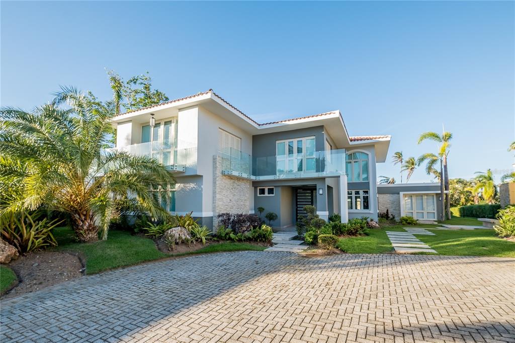 This stunning and spacious property has 5 bedrooms, 6.5 bathrooms and 5,299 sq. ft. and is located in Dorado Beach East community. This modern property features a magnificent pool, private backyard, high ceilings, and spacious kitchen with top of the line appliances.

The Dorado Beach East community is private, gated, family friendly and offers a wide range of facilities that you can enjoy. The facilities include scenic pools, clay tennis courts, basketball and beach volleyball courts, a basic gym, a game room, a 3-par golf course that winds through the neighborhood, and an aviation themed park which has a custom water park and sand park.

Located within the Dorado Beach Resort, since it is a 2,000-acre natural reserve most of the communities are 1-3 miles away from the beach and Hotel. This being said, the entire resort is interconnected via golf cart trails, meaning that you can have easy access (walking or in golf cart) to the different communities and amenities within this Resort.