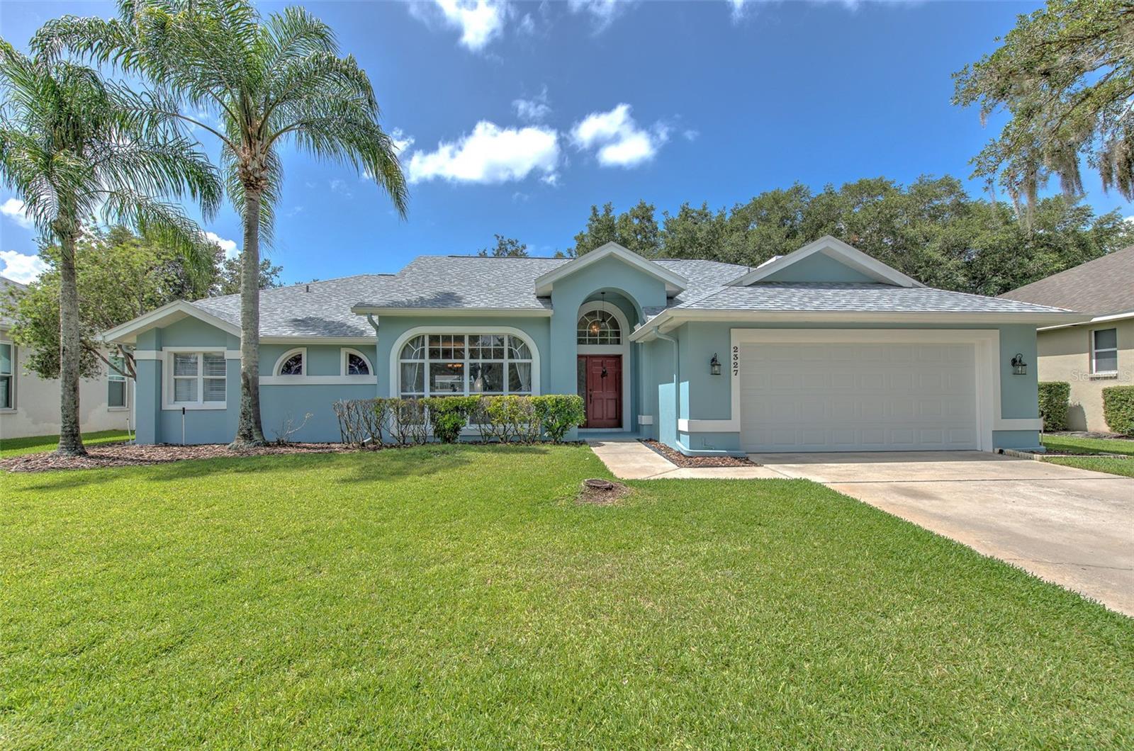 One or more photo(s) has been virtually staged. Welcome to sought after The Greens of Bloomingdale Ridge community with a low $275 annual HOA fee and no CDD fees. This 4 bedroom pool home features major recent improvements including a 2025 roof, 2025 garage door, 2025 vinyl fencing, 2024 variable-speed pool pump, recently serviced A/C, and freshly serviced windows and sliders backed by a 3-year transferable warranty. The curb appeal shines with brand new mulch and year-round green grass supported by reclaimed water sprinklers. The fully-fenced backyard is built for relaxing and entertaining with a screened-in lanai and a gas-heated pool and spa, complete with a pool safety fence and exterior access to a full bathroom. Inside, the split floor plan offers optimal privacy, boasting 4 spacious bedrooms, 2 full bathrooms, and a powder room perfect for guests. Oversized windows and sliders bathe the home with natural light and a pool view from nearly every room, and the kitchen and bathrooms are enhanced with gorgeous granite countertops. All of this in a prime location zoned for top-rated Bloomingdale schools and very close to two Publix Supermarkets, a new Whole Foods coming soon, Sprouts, Starbucks, two breweries, and just 4-5 miles from Target, 301, and I75.