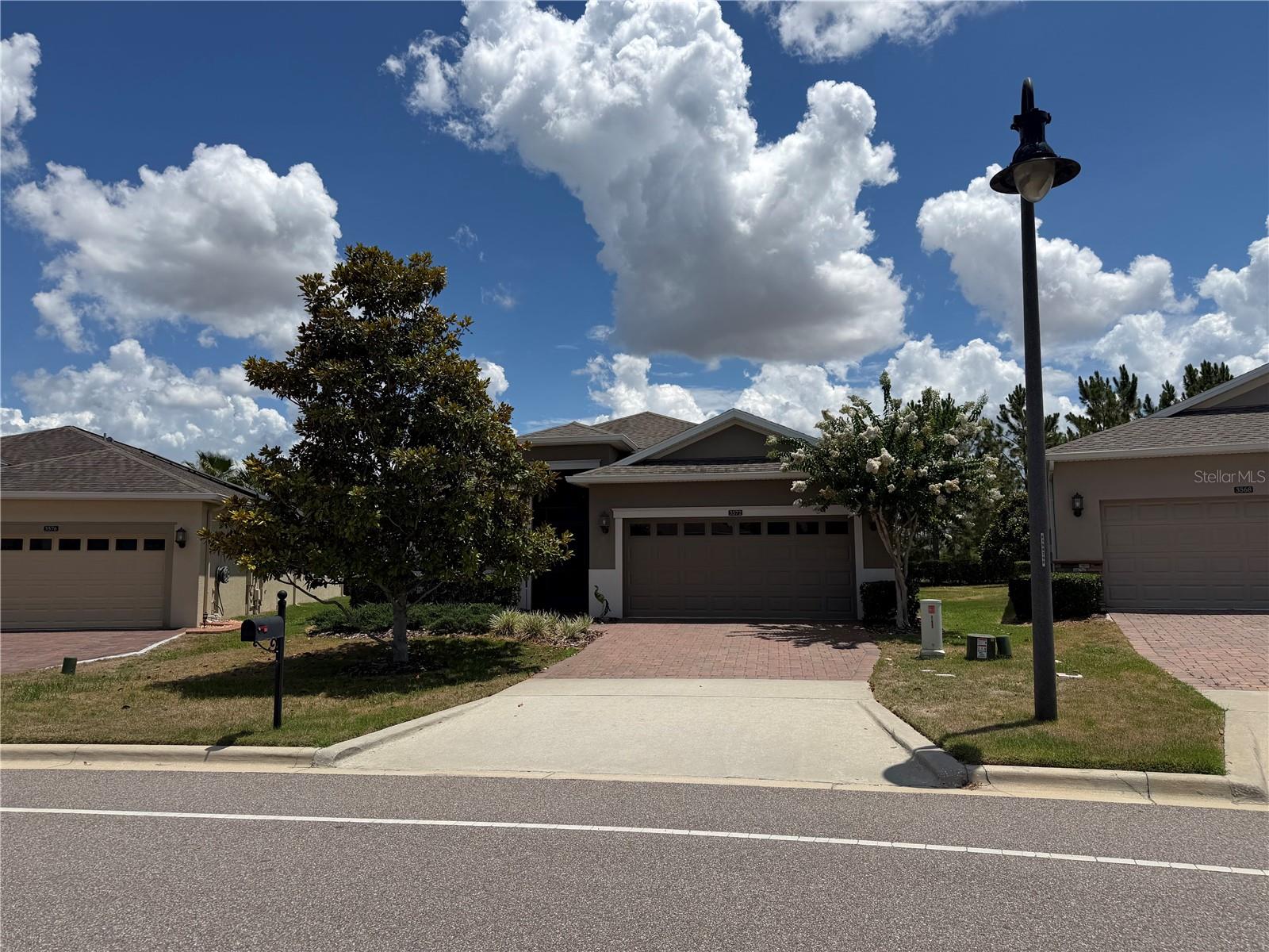 Welcome to 3572 Kinley Brooke Lane in the highly sought-after 55+ gated community of Heritage Hills in Clermont, Florida. This beautifully maintained Columbus II model offers 3 bedrooms, 2 bathrooms, and 1,672 square feet of thoughtfully designed living space on an oversized, professionally landscaped homesite. Built in 2016, this move-in-ready residence combines comfort, functionality, and resort-style living.

Step inside to discover an open-concept floor plan featuring attractive wood-look tile flooring throughout the main living areas, abundant natural light, and a spacious great room ideal for entertaining. The well-appointed kitchen showcases granite countertops, decorative tile backsplash, ample cabinetry, a cozy breakfast nook, and multiple windows that create a bright and inviting atmosphere.

The private owner's suite offers a relaxing retreat, while two additional bedrooms provide flexibility for guests, hobbies, or a home office. Enjoy Florida living year-round from the screened front entry and expansive screened lanai with brick pavers and shades, perfect for morning coffee or evening relaxation. Additional upgrades include whole-house gutters and downspouts, a generator hookup in the garage, updated thermostat, and new AC (2024) with 10 year warranty that covers parts and labor.

Residents of Heritage Hills enjoy an exceptional lifestyle with a guard-gated entrance and resort-inspired amenities including a heated pool and spa, fitness center, tennis and pickleball courts, basketball, bocce ball, shuffleboard, clubhouse, ballroom, arts and crafts room, billiards room, and an active calendar of social events and clubs. The community also features approximately five miles of walking trails, beautifully maintained grounds, and convenient access to shopping, dining, medical facilities, and major roadways.

Offering the perfect blend of low-maintenance living and vibrant community amenities, 3572 Kinley Brooke Lane presents a wonderful opportunity to enjoy the best of Central Florida's active adult lifestyle.

*Monthly HOA Dues include cable and internet services.