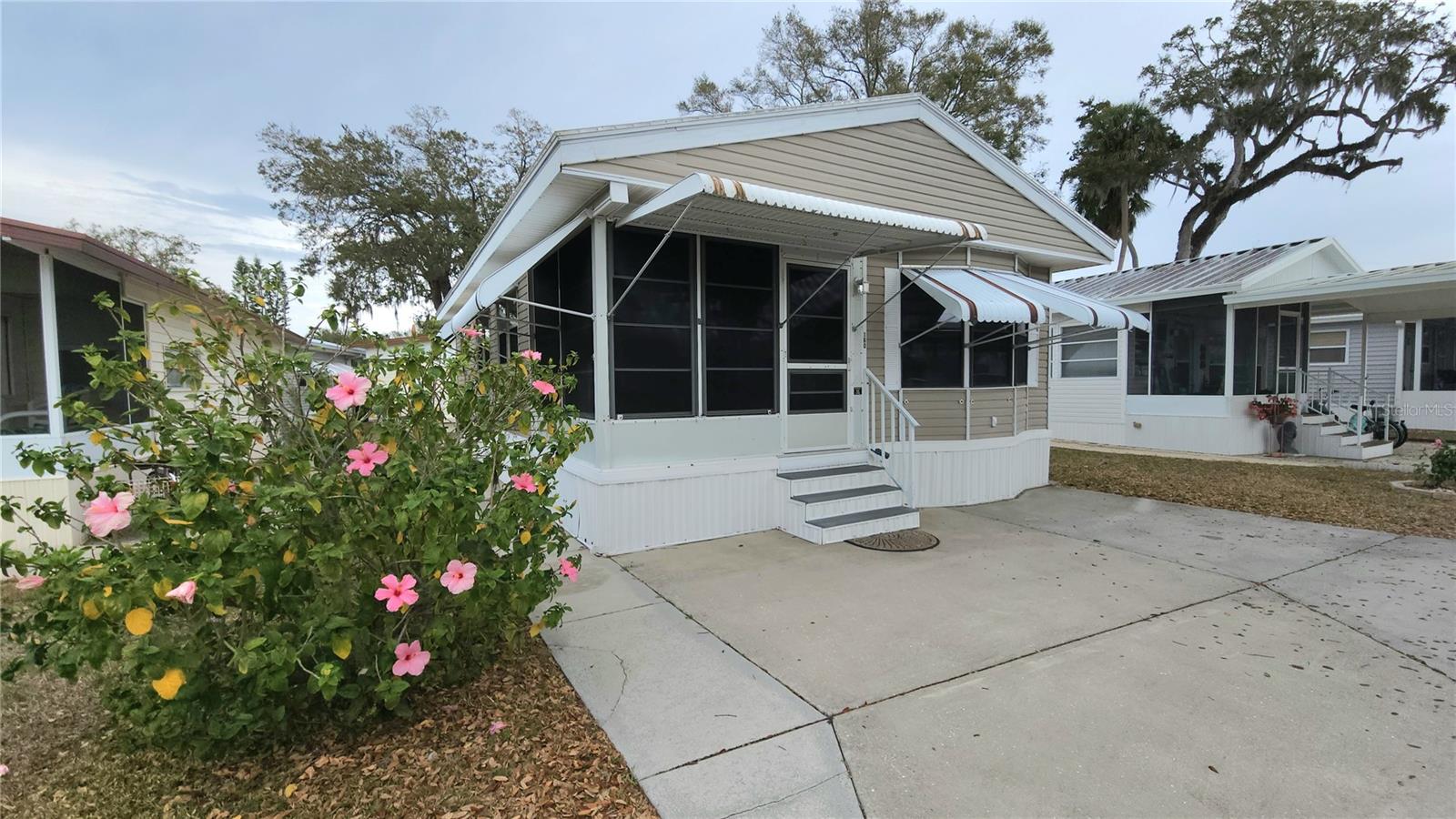 PRICE IMPROVEMENT ON THIS TURNKEY MOBILE HOME IN ACTIVE 55+ COMMUNITY! This one bedroom, 1 1/2 bath home features a comfy, enclosed front porch, covered back porch, space to park two vehicles, newer membrane roof, and a spacious kitchen. There is a separate laundry room and plenty of storage. Central A/C. Awnings and an additional cabinet storage shed outside make maintenance easier. SUGAR CREEK ESTATES HAS QUARTERLY HOA FEES OF $550 which include water, sewer, cable, internet & grass mowing. The community has a clubhouse, pool, shuffleboard, and laundry facilities. Sold for CASH ONLY. A minimum 750 credit score is required to purchase in this community. Property is near the Braden River and River Links Golf Course. Sorry, this is not a dog lot.