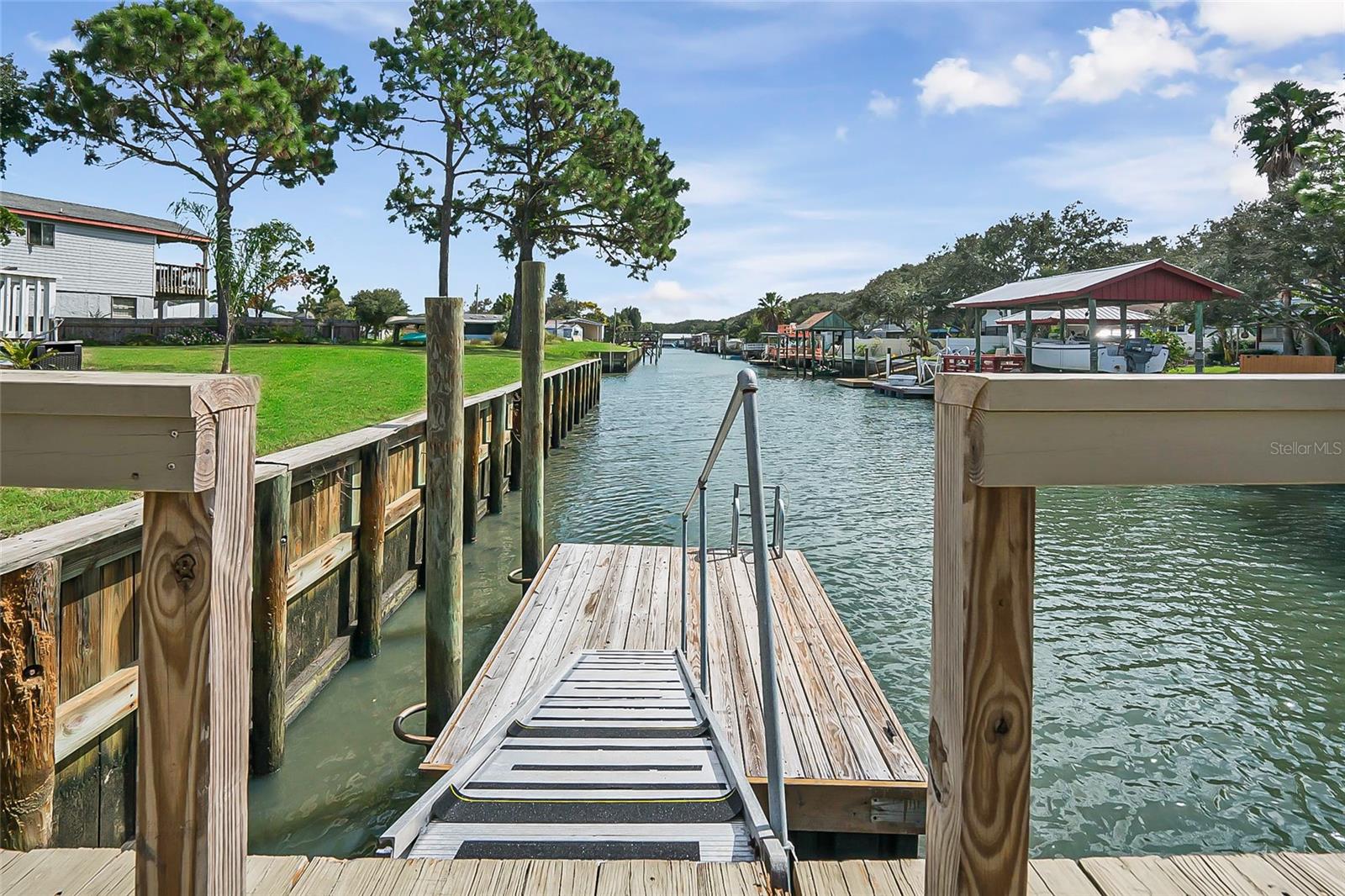 Canal-Front Waterfront Home for Sale | Crescent Beach, FL Treasure Beach | Built in 2023 | 1,494 Sq Ft | Owned Land Experience coastal living in this beautifully maintained canal-front home in the Treasure Beach neighborhood of Crescent Beach. Built in 2023, this 1,494 sq ft home on owned land offers modern comfort, direct water access, and access to the private neighborhood beach walkover. Situated on a peaceful saltwater canal with 167 feet of waterfront, this property is ideal for boating, fishing, and relaxing by the water. Enjoy your private boat lift, fish from your backyard dock, and reach the Intracoastal Waterway within minutes. The expansive canal frontage also offers room to add a jet ski lift, floating docks, or other waterfront upgrades. The large yard provides space to create your dream outdoor retreat, with room for a pool and garage.