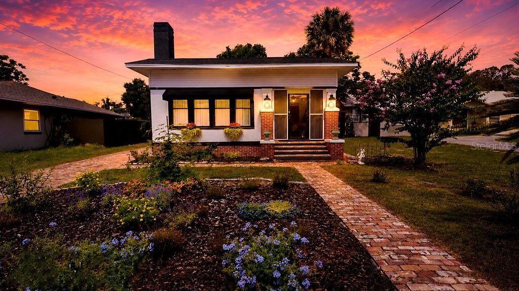 Restore your soul with this charming 1925 American Craftsman Bungalow...Pull into the driveway and walk to the front door like you are travelling through time- both the front sidewalks and driveway are carefully constructed from hand-picked antique bricks extracted from the 1915 Leesburg High School. As you enter, imagine yourself relaxing in one of the new screened-in porches with family and friends, feeling the breezes off Lake Gracie. Open the French doors into the living room and feel the cozy embrace of "coming home". Your creativity will be set free when you choose furnishings to match the carefully curated antique pine floor (also from Leesburg High School). Ordained with original built-ins in the dining room, living room and kitchen. You can feel secure in the fact that there is a new  roof with not just new shingles, but a specifically engineered structure underneath. All concerns you may have regarding the purchase of an older home are assuaged- new electric panel, new electric subpanel, all new lighting fixtures throughout... other mechanical systems have either been well-serviced, updated new or restored and repaired.  The effective age of this fine home has been changed to give you a sense of security for many years to come
Delightfully restored unfitted kitchen with built-ins and exposed brick.
The home was built at a time when everything was done by hand.
In the mornings, you can go down the hill and take a walk around beautiful Lake Gracie- almost exactly a mile. This quiet neighborhood gives you the privacy you have longed for but is just minutes from downtown Eustis and Mt. Dora with access to shopping, restaurants, health care and all that you will need. 
Ten Minutes from Renninger's Antique Market.
45 Minutes from Disneyworld, Warner Bros Studios, Seaworld, Orlando and an hour from the Ocean and the Gulf, depending on whether you feel like driving east or west.
You have to be inside this home to truly appreciate it.