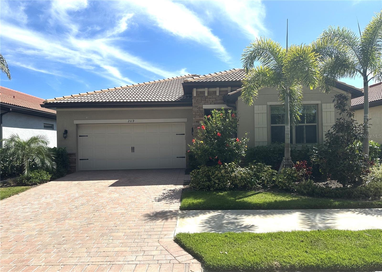 This stunning 2-bedroom plus den, 2-bathroom lakeview home is located in the distinguish gated community of Toscana Isles. The flexible space is perfect for an office, den, or third bedroom. Highlights include an open floor plan, a beautiful kitchen with a center island, crown molding, granite countertops, walk-in pantry, and a dining area bathed in natural light with views of the lake and stainless-steel appliances. A sliding glass door in the dining area opens to a screened-in lanai. The main living areas feature ceramic tiles, while the bedrooms are carpeted. The primary bedroom offers dual walk-in closets and an ensuite bathroom with double vanities and a walk-in shower. Toscana Isles is a maintenance-free community offering a wealth of amenities to support an active and social lifestyle. Residents enjoy a heated community pool, a lakefront activities room with a catering kitchen, a billiards room with a bar and TVs, a modern fitness center, tennis and bocce courts, a playground, and a large fire pit. The community also offers fishing, kayaking, and canoeing on its extensive lakes. Toscana Isles' prime location is just a short drive from the downtown areas of Venice and Sarasota, with easy access to restaurants, shops, the Legacy Trail, I-75, Road 41, and the new Sarasota Memorial Hospital Venice Campus