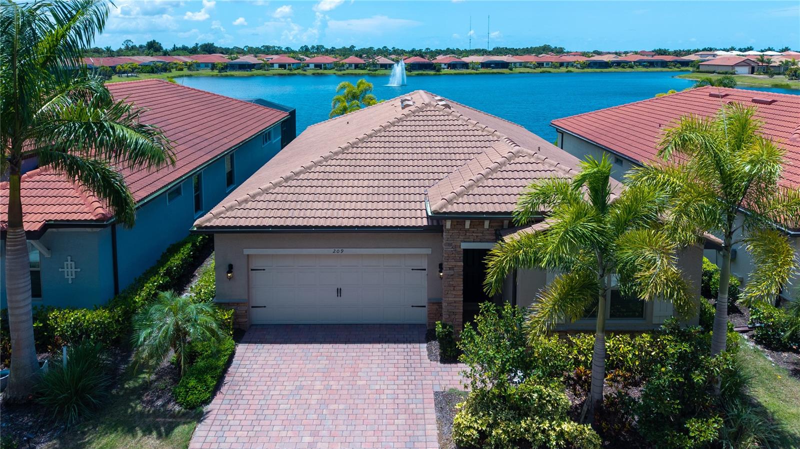 This stunning 2-bedroom plus den, 2-bathroom lakeview home is located in the distinguish gated community of Toscana Isles. The flexible space is perfect for an office, den, or third bedroom. Highlights include an open floor plan, a beautiful kitchen with a center island, crown molding, granite countertops, walk-in pantry, and a dining area bathed in natural light with views of the lake and stainless-steel appliances. A sliding glass door in the dining area opens to a screened-in lanai. The main living areas feature ceramic tiles, while the bedrooms are carpeted. The primary bedroom offers dual walk-in closets and an ensuite bathroom with double vanities and a walk-in shower. Toscana Isles is a maintenance-free community offering a wealth of amenities to support an active and social lifestyle. Residents enjoy a heated community pool, a lakefront activities room with a catering kitchen, a billiards room with a bar and TVs, a modern fitness center, tennis and bocce courts, a playground, and a large fire pit. The community also offers fishing, kayaking, and canoeing on its extensive lakes. Toscana Isles' prime location is just a short drive from the downtown areas of Venice and Sarasota, with easy access to restaurants, shops, the Legacy Trail, I-75, Road 41, and the new Sarasota Memorial Hospital Venice Campus