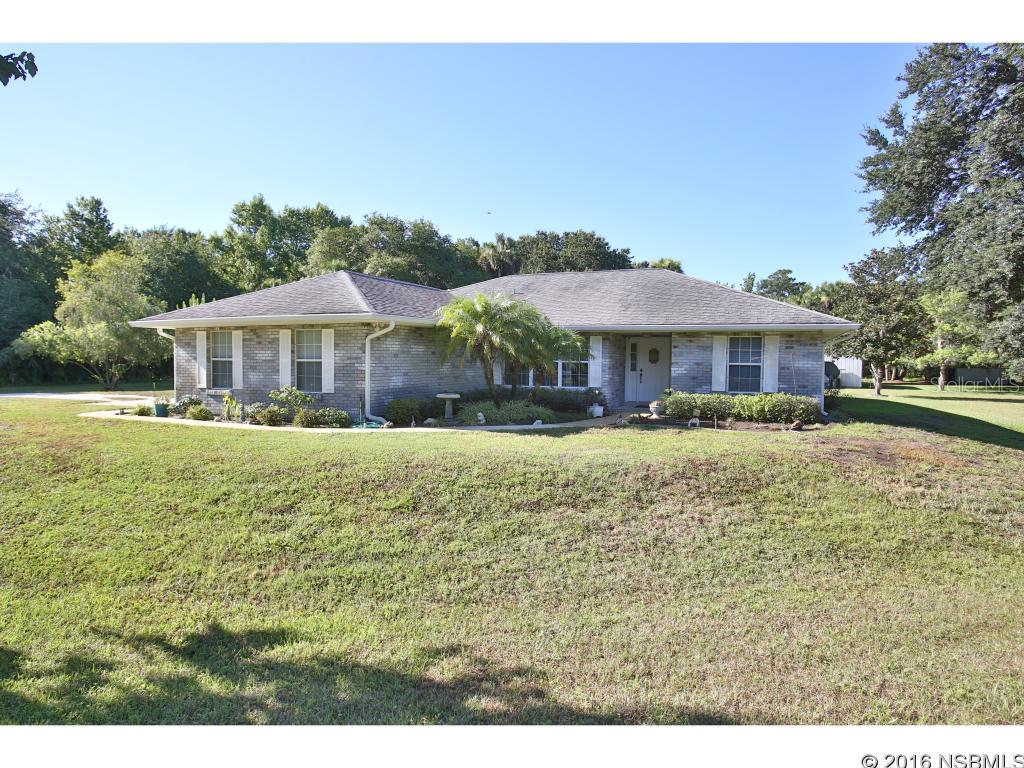 Custom block home built on 3.80 acres.  Property is completely cleared with beautiful oaks, Magnolias, Maple and more.  Sit by one of the two ponds and enjoy the view..  House boasts great room with large kitchen that has room for the family.  The breakfast bar is 13.4 long.  Step out of the great room through a set of French doors to the covered screened porch big enough to host parties and events.  From the porch you can take in the peaceful setting of the back pasture.  Also located in the back half of property is a 32x24' detached garage  or workshop for all your toys and tools. Window AC in workshop could be guest apt or office. The house has a double car garage, good sized laundry room, and two pantries. And for emergencies the home is equipped with two generators.  One generator for the house and one for the well. Water softener was replaced in the past three years. This pristine home has been well maintained and is move in ready. Bring your horses, boats, rv's, and more.