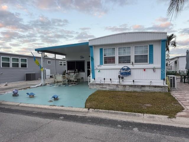 PRICE IMPROVEMENT!! This 14-ft-wide manufactured home offers 1 bedroom and 2 full bathrooms, both updated with walk-in showers and new vanities. The kitchen features new countertops and opens seamlessly into the living room, creating an open-concept space with high ceilings and abundant closet storage. A spacious Florida room adds extra living area, while the utility room includes a washer and dryer. The property provides parking for two vehicles at no extra cost and comes furnished with three queen beds, a 65-inch TV, and patio furniture. Situated in a gated community, residents enjoy amenities such as a pool, shuffleboard, pickleball, a fitness center, clubhouse, and library.