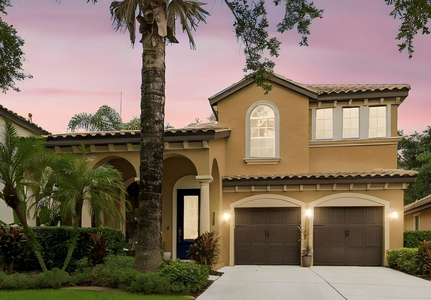 Welcome to this stunning Modern Mediterranean residence nestled on a private conservation homesite within the prestigious gated community of Grand Hampton! Meticulously maintained and beautifully appointed, this Mercedes Homes-built residence offers 4 bedrooms, a dedicated home office, 2.5 bathrooms, and 3,030 square feet of thoughtfully designed living space that blends timeless elegance with everyday comfort.

From the moment you arrive, you'll appreciate the exceptional pride of ownership and impressive curb appeal. The barrel tile roof has been professionally cleaned and maintained as needed, while elegant architectural details and custom designer finishes create a warm, sophisticated atmosphere throughout. Sun-filled open living spaces are perfect for both entertaining and everyday living.

The heart of the home flows seamlessly into spacious gathering areas, while the dedicated home office with custom built-in cabinetry provides an ideal workspace. Elegant picture frame molding enhances the dining room and primary suite, and modern decorative wall paneling adds character and style to the family room.

Escape to the luxurious primary suite, your own private retreat featuring custom built-in cabinetry, a relaxing sitting room, two private balconies, and a screened rear balcony overlooking the tranquil conservation setting. The spa-inspired primary bath includes a dimmable lighting feature, creating the perfect ambiance to unwind after a long day.

Thoughtful upgrades continue throughout the home, including a dual-entry bathroom for added convenience, an expansive wraparound under-stair storage closet with lighting at both ends, an updated kitchen faucet with a concealed pull-down sprayer, new smoke detectors throughout, and a carbon monoxide detector for added peace of mind.

Step outside to enjoy the spacious private courtyard and screened lanai, offering the perfect space to relax, entertain, or simply enjoy the peaceful natural surroundings.

Life in Grand Hampton means enjoying one of Tampa's premier resort-style communities, complete with a 24-hour manned gated entrance, resort-style pool with waterslide and spa, heated lap pool, elegant clubhouse, state-of-the-art fitness center, tennis courts, pickleball courts, basketball court, playgrounds, parks, scenic walking trails, and lake access.

Ideally located near I-75 and I-275, AdventHealth, Pasco-Hernando State College (PHSC), AdventHealth Center Ice, The Shops at Wiregrass, Tampa Premium Outlets, top-rated dining, and everyday conveniences, this exceptional home offers the perfect combination of luxury, privacy, and convenience.

This is more than a home.  It's the lifestyle you've been waiting for. Schedule your private showing today!