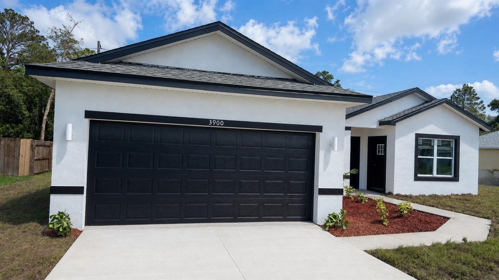 Under Construction. BRAND NEW 2026 HOME WITH IN-LAW WITH PRIVATE ENTRANCE IN MARION OAKS! This stunning newly constructed home combines modern living with great income potential, featuring a separate in-law suite with 1 bedroom, 1 bathroom, a kitchen and WASHER AND DRYER, perfect for extended family or additional rental opportunities. The open-concept layout is filled with natural light and luxury vinyl flooring throughout, creating a warm and welcoming space. The spacious primary bedroom includes a master bathroom with DUAL SHOWER, dual sink, offering both comfort and convenience. A SMART KEY entry system adds an extra level of security and ease of access. With a builder’s warranty included for added peace of mind, this property is ideal for families seeking flexibility or investors looking for a promising opportunity.