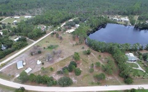 Experience the perfect blend of serenity and value with this cleared 1.33-acre lakefront lot at 116 Osceola Road. Located in the peaceful Plantation Pines II community of Georgetown, this build-ready parcel is the ideal site for your custom-built estate or a high-quality manufactured home. A major financial highlight of this property is its size; because it exceeds one acre and sits outside the Basin Management area, it does not require a costly specialized septic filtration system, saving you thousands in upfront development expenses.

Boasting direct water access, this property is a haven for outdoor enthusiasts. You are minutes away from world-class bass fishing on Lake George and the scenic St. Johns River, with the Ocala National Forest nearby for endless exploration. The unique lot shape ensures maximum privacy, while the lack of HOA fees and restrictive boards gives you total freedom to design your ideal lifestyle. Electricity is available at the street, and paved road access makes the location both secluded and accessible. With low annual taxes and a prime waterfront location, this property offers a rare opportunity to secure a significant piece of Florida paradise at an exceptional price.