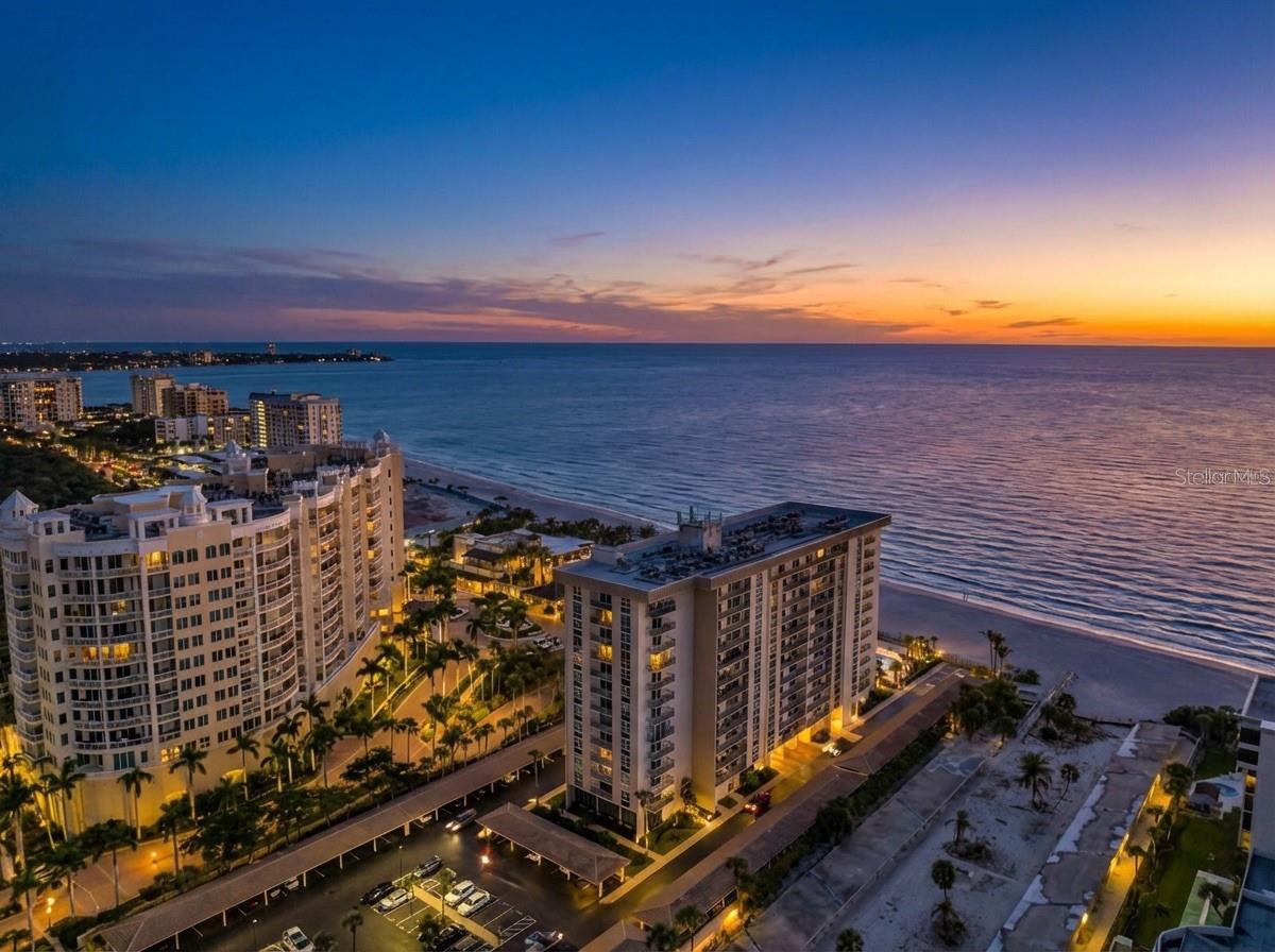 Great price reduction and motivated seller. Unforgettable. Unmatched. Unrivaled. Welcome to Lido Beach Club. From the moment you step inside this spectacular, beautifully updated 2nd-floor residence, you’ll feel as though you’ve arrived at your own private luxury suite and on a permanent vacation. The instant you enter, an explosion of blue skies, turquoise waters, and endless coastline greets you, creating a front-row experience of Sarasota’s most breathtaking sunsets. This home doesn’t just impress—it absolutely captivates.

Every detail of this 1,421-square-foot residence has been elevated to capture the essence of luxury coastal living. The A/C system and water heater were replaced just last year, giving you immediate peace of mind, while the open, airy layout pulls your eyes straight to the sweeping Gulf views that define every room. The kitchen feels like it belongs in a five-star resort. Solid wood cabinetry pairs with rich granite countertops, tiled backsplashes, and sleek stainless-steel appliances to create an atmosphere that is both elegant and energizing. It’s the perfect setting for morning coffee, evenings with friends, or simply admiring the beauty of the shoreline from your own dining space.

The two bedrooms each offer a magical, immersive experience with floor-to-ceiling windows that make the Gulf feel close enough to touch. Both en-suite bathrooms have been transformed into spa-level retreats, featuring exquisite tilework, seamless glass showers, and refined, modern finishes that elevate your daily routine into something extraordinary. This is where luxury meets serenity—every moment feels indulgent.

Step onto the private balcony and let the warm Gulf breeze wrap around you as you take in wide, unobstructed water views framed by classic wrought iron detailing. It’s a picture-perfect vantage point, complete with a charming glimpse of the Ritz-Carlton Beach Club next door, reminding you that you’re living at one of the most coveted addresses on the entire coastline.

Life at Lido Beach Club feels like being on permanent vacation. The building is expertly managed and offers resort-style amenities designed for relaxation and enjoyment. A heated beachfront pool with tropical Tiki seating creates a dreamy setting for quiet afternoons. A serene garden provides moments of calm, while a well-equipped fitness room and a welcoming social room give residents beautiful spaces to connect and unwind. Gated access leads directly to the silky sands of Lido Beach, and convenient assigned parking with additional ground-floor storage ensures effortless everyday living.

The location is simply phenomenal. Nestled on the exclusive south end of Lido Key, the residence is steps from the water, across from the lush natural beauty of South Lido Park, and next door to the iconic Ritz Tiki Bar. St. Armands Circle—with its world-famous shopping, dining, and entertainment—is just one mile away, and vibrant downtown Sarasota is only a quick ride via the free Bay Runner trolley.

This home is more than a coastal retreat; it’s a daily invitation to live life inspired. Luxury, beauty, and the magic of Sarasota’s waterfront come together in a way that feels truly extraordinary. This is your chance to embrace the Sarasota lifestyle at its absolute finest.