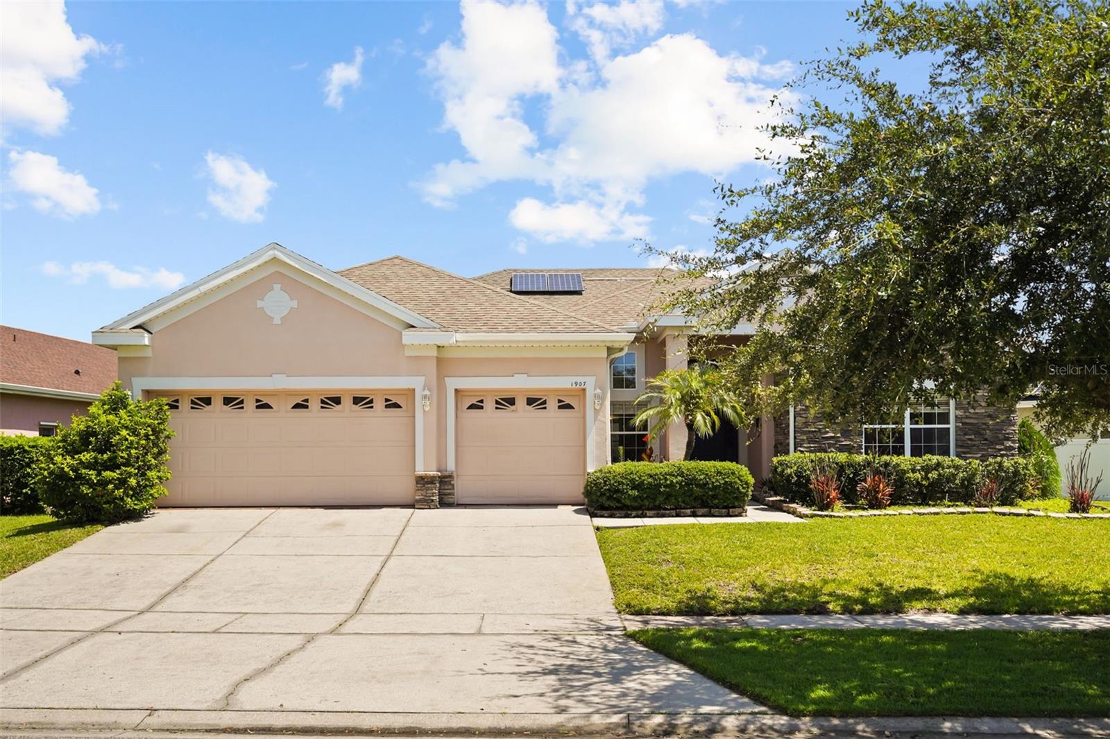 Investors welcome this beautiful home that offers 4-bedrooms plus a bonus den that can be easily converted into a 5th-bedroom, 2-bathroom home with a 3-car garage in the Falcon Trace community. Kitchen features granite countertops, stainless steel appliances, and a eating area that opens directly onto the living room with plenty of windows show casing the beautiful, paved backyard. The primary suite is large with his and her closets, separate from the rest of the bedrooms which lie on the left wing of the home upon entry.  Great neighboring schools and the location is unbeatable: with easy access to I-4, 417, and the Turnpike, you’ll be just minutes from Orlando International Airport, world-famous attractions including Disney, SeaWorld, and Universal Studios, plus endless shopping, dining, and entertainment options. Schedule your showings today! Home is Priced to Sell.