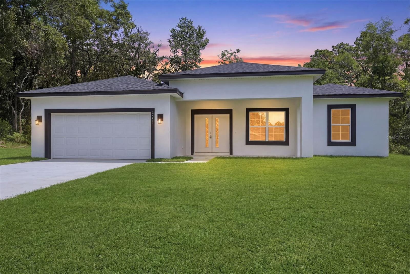 Oversized 0.28-acre lot! Brand-new, never-lived-in 3-bedroom, 2-bath residence in the heart of Citrus Springs, offering modern Florida living with a bright, open-concept design filled with natural light. The stylish kitchen features quartz countertops, wood cabinetry, stainless steel appliances, and seamless flow into the spacious living and dining areas. Both bathrooms showcase elegant floor-to-ceiling ceramic tile showers, while the luxurious primary suite includes a spa-inspired double-shower bath. Enjoy indoor-outdoor living with a welcoming covered front porch, oversized sliding glass doors, and a large covered rear lanai overlooking the expansive backyard. Additional highlights include a 2-car garage, quality craftsmanship, and contemporary finishes throughout. Conveniently located near Citrus Springs Golf & Country Club, the Withlacoochee State Trail, shopping, dining, medical facilities, and outdoor recreation. Approximately 1.7 miles to Citrus Springs Elementary School, 2.3 miles to Citrus Springs Middle School, and just minutes from the crystal-clear waters of Rainbow River. Move-in ready and designed for comfort, style, and everyday enjoyment.