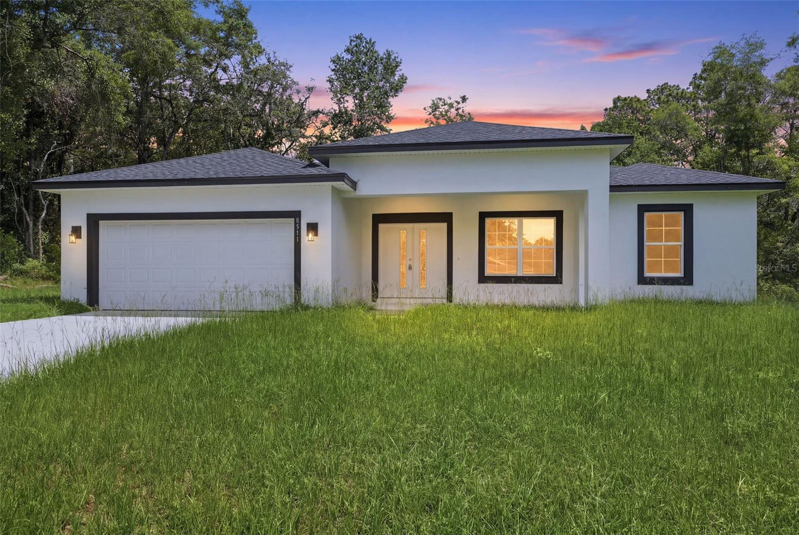 Oversized 0.28-acre lot! Brand-new, never-lived-in 3-bedroom, 2-bath residence in the heart of Citrus Springs, offering modern Florida living with a bright, open-concept design filled with natural light. The stylish kitchen features quartz countertops, wood cabinetry, stainless steel appliances, and seamless flow into the spacious living and dining areas. Both bathrooms showcase elegant floor-to-ceiling ceramic tile showers, while the luxurious primary suite includes a spa-inspired double-shower bath. Enjoy indoor-outdoor living with a welcoming covered front porch, oversized sliding glass doors, and a large covered rear lanai overlooking the expansive backyard. Additional highlights include a 2-car garage, quality craftsmanship, and contemporary finishes throughout. Conveniently located near Citrus Springs Golf & Country Club, the Withlacoochee State Trail, shopping, dining, medical facilities, and outdoor recreation. Approximately 1.7 miles to Citrus Springs Elementary School, 2.3 miles to Citrus Springs Middle School, and just minutes from the crystal-clear waters of Rainbow River. Move-in ready and designed for comfort, style, and everyday enjoyment.