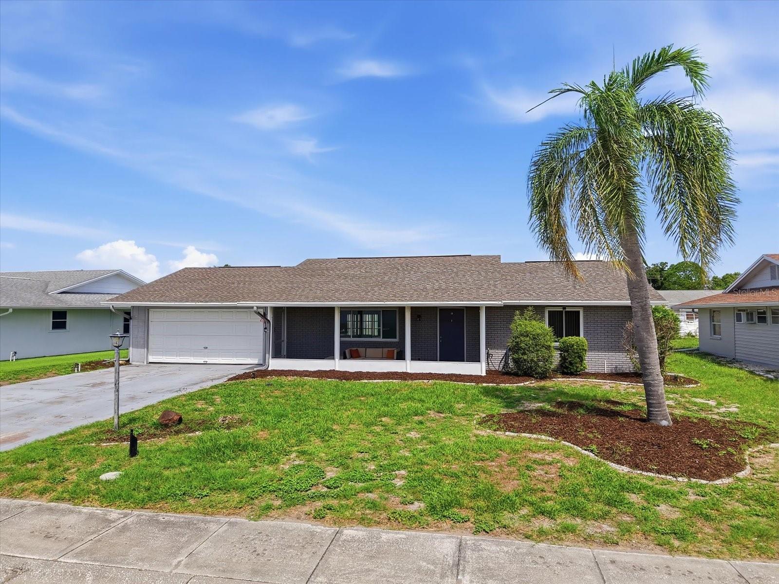 Welcome to 1404 Seton Hall Drive, an extensively remodeled, move-in-ready 2-bedroom, 2-bath home offering comfortable, low-maintenance living in the heart of Sun City Center, one of Florida’s most established 55+ active-adult communities.

Renovated inside and out, this home combines modern finishes with practical improvements designed for easy Florida living. In 2021, the interior and exterior were painted, the roof and air-conditioning system were replaced, and new flooring was installed throughout. Luxury vinyl plank flooring flows through the main living areas, while carpeting adds comfort to the bedrooms.

The remodeled kitchen features white shaker-style soft-close cabinetry, granite countertops, stainless steel appliances, and a clean, contemporary design ideal for everyday meals and entertaining. Light switches, electrical outlets, ceiling fans, light fixtures, plumbing fixtures, and other finishing details throughout the home have also been updated for a polished, cohesive feel.

Both bathrooms have been renovated with new flooring, vanities, toilets, plumbing fixtures, and modern finishes. The primary bathroom stands out with a beautiful stone floor and contemporary tiled walls, creating a stylish, spa-inspired retreat.

Additional improvements provide comfort, efficiency, and peace of mind. Impact-resistant windows and sliding glass doors were installed in 2022, and the front porch was screened the same year, creating a relaxing place to enjoy the Florida breeze. A privacy fence was added in 2024 for a more secluded outdoor setting, and the garage floor has been painted for a clean, finished appearance.

Enjoy exceptional value with community fees of only $346 per year and no CDD fees. The home is also located in Flood Zone X, where flood insurance is not required.

Sun City Center offers outstanding recreational and social amenities for an active, connected lifestyle. Residents enjoy a state-of-the-art fitness center, indoor and outdoor swimming pools, a premier softball facility, 10 tennis courts, six pickleball courts, three lawn bowling greens, shaded horseshoe pits, volleyball courts, dog parks, and a billiards room. The community also features well-equipped arts-and-crafts rooms, a computer lab, and a variety of large and small gathering spaces for dances, meetings, theater productions, cards, clubs, and social events.

With more than 200 clubs and activities, there are countless opportunities to stay active, explore new interests, and connect with neighbors. Golf-cart access makes it easy to reach nearby shopping, restaurants, medical offices, clubhouses, recreation, and everyday conveniences.

Ideally situated between Tampa, Sarasota, and St. Petersburg, this home also provides convenient access to Gulf Coast beaches, airports, entertainment, cultural attractions, and leading medical care.

Whether you are searching for a full-time Florida residence or a seasonal retreat, 1404 Seton Hall Drive offers extensive remodeling, valuable upgrades, affordable community living, and an exceptional active-adult lifestyle. Bring your golf cart and begin enjoying Sun City Center from day one.