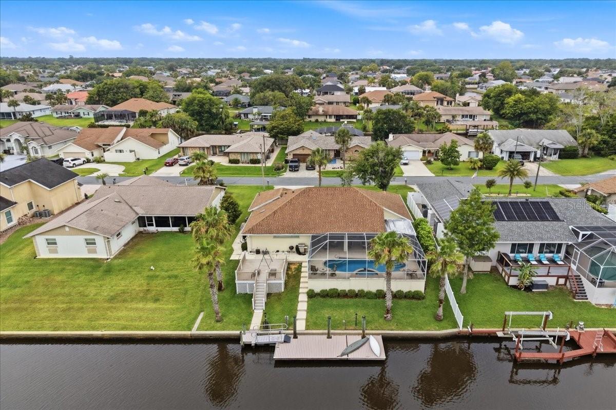 LIVE THE SALTWATER LIFESTYLE you’ve always dreamed of! This stunning waterfront pool home is perfectly positioned on a spectacular intersecting saltwater canal, offering some of the most breathtaking wide-water views you’ll find in Palm Coast. From the moment you arrive, you’ll be captivated by the endless water vistas, amazing sunsets, and the daily parade of dolphins and manatees right from your backyard.
Currently operating as a successful Airbnb, this meticulously maintained 3-bedroom, 2-bath home is truly move-in ready and offers the perfect blend of luxury, relaxation, and investment potential. Designed to embrace Florida living, the open-concept floor plan features triple disappearing sliders that completely open the home to the oversized screened lanai and sparkling pool, creating an entertainer’s paradise where indoor and outdoor living become one.   The beautifully updated kitchen boasts white cabinetry, solid surface countertops, stainless steel appliances, and a breakfast bar overlooking the water. The spacious primary suite offers a private retreat with an upgraded spa-like bath designed for comfort and relaxation.   Boating enthusiasts will fall in love with the 30’ x 12’ dock complete with water and electric, Trex decking, bulkheaded seawall, and quick access to the Intracoastal Waterway. Located just 200 feet from the canal tip, you’ll spend less time navigating and more time enjoying life on the water.   Recent improvements include a NEW AC in 2024, roof in 2014, and Trex dock and deck replacement in 2014.  And the best part? NO HOA! Bring your boat, your toys, and your waterfront dreams. Located just minutes from the marina, only 15 minutes to the sandy shores of Flagler Beach, and close enough to bike to the shops, restaurants, and entertainment of European Village. Whether you’re searching for a full-time residence, vacation getaway, or income-producing property, this home delivers the ultimate Florida waterfront experience.   Opportunities like this are rare—spectacular views, saltwater access, a sparkling pool, and NO HOA. Don’t just buy a home… embrace a lifestyle!