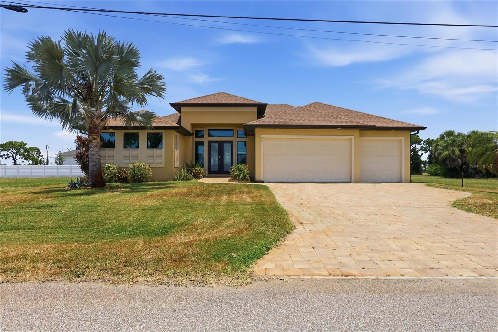Welcome to this beautifully crafted 3-bedroom, 2-bath home built by one of the area's well respected builders, offering quality construction, thoughtful design, and immediate occupancy. Featuring a spacious 3-car garage and Low-E impact windows and doors throughout, you'll enjoy year-round peace of mind with no hurricane shutters to install.

Step through the double-door entry into a bright, open-concept floor plan designed for effortless entertaining. Soaring vaulted ceilings, abundant natural light, and stunning zero-corner sliding glass doors seamlessly blend indoor and outdoor living. The chef-inspired kitchen showcases granite countertops, soft-close cabinetry, a stylish tile backsplash, stainless appliances, generous prep space, and a large island perfect for casual dining and gathering.

The private owner's suite is a relaxing retreat with direct lanai access, dual walk-in closets, and a luxurious en-suite bath featuring double vanities and a spacious walk-in shower. Two additional guest bedrooms offer comfortable accommodations and share a beautifully appointed bath with convenient access to the pool.

Step outside to your own tropical paradise. The screened pool and expansive lanai provide the perfect setting for entertaining, relaxing, or simply enjoying Florida's sunshine year-round.

Conveniently located near championship golf courses, shopping, dining, and entertainment, you'll also be just a short drive from Englewood Beach, Manasota Key, and Boca Grande. Whether you're searching for a full-time residence, seasonal retreat, or investment opportunity, this exceptional home delivers the very best of the Florida lifestyle.
