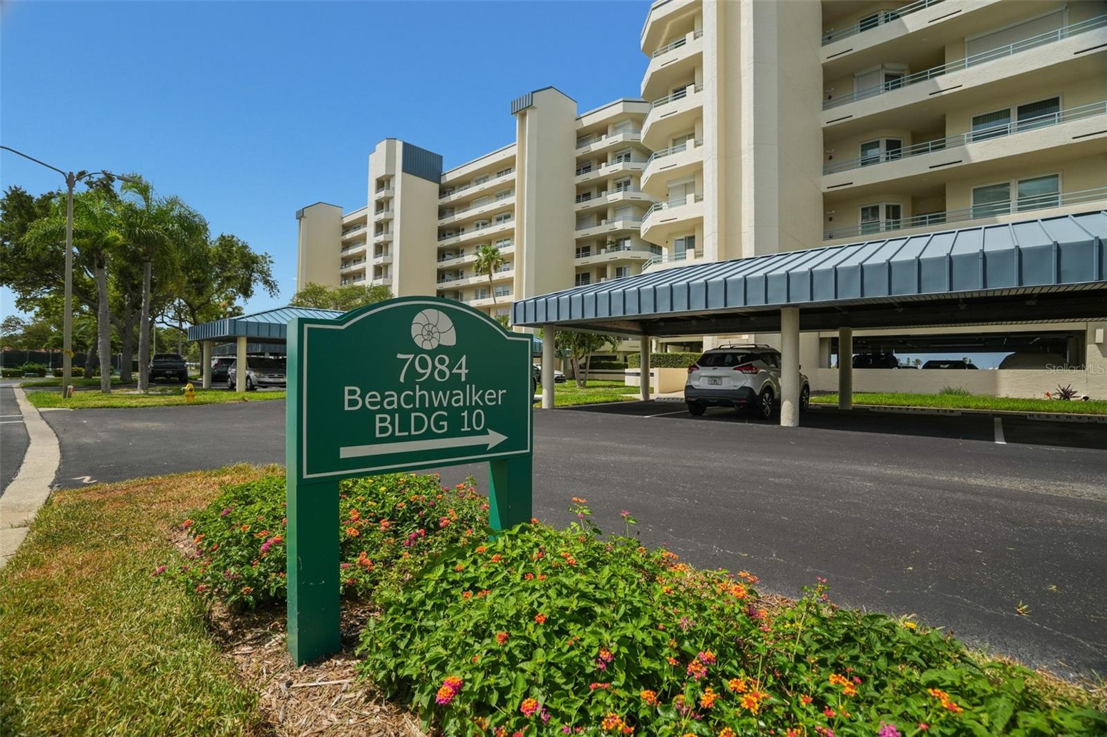 “BEACHWALKER” -Most desirable location in all of Harbourside— resort style living in one of South Pasadena’s finest waterfront communities. An immaculate, beautifully maintained, DIRECT WATERFRONT 2-bedroom 2- bath has been thoughtfully updated and cared for, providing comfort and quality. Plenty of natural daylight. West facing balcony with beautiful sunset views, enhanced by new gemstone floor coverings and protected with hurricane impact windows and electric shutters on both the balcony and master bedroom— (shutter motor updated in 2023).
Unit features newer stainless-steel appliances, updated ceiling fans and light fixtures, plantation shutters on all windows and the balcony, solid surface kitchen counters, and a granite vanity top in the primary bath. Additional upgrades include newer garbage disposal, kitchen faucet, and custom shelving in all closets. The AC (2019) and hot water tank (12/2022) ensure efficient, reliable performance. Convenient under building assigned parking space #94. Complete Elevator modernization in 2025. A gated community with Exceptional amenities including Swimming pools and Spa's, EV charging stations, pickleball courts, tennis courts, shuffleboard, an active clubhouse, and miles of waterfront walking paths. Boat slips, guest boat docks (available on a first come-first serve) fishing pier, and a rare opportunity to own a pristine unit in a vibrant, amenity rich waterfront, community—perfect for full-time coastal living. Just minutes to the finest GULF Beaches. Oh, and a pet friendly community. Perfect timing to send out invites for the Pasadena Christmas boat parade that passes by right in front of your balcony. 
In addition, this unit is sold with a full wall media cabinet/bookcase with electric remote-control fireplace, plus a kitchen dinette table and 2 chairs. A MUST SEE! Schedule your showing.