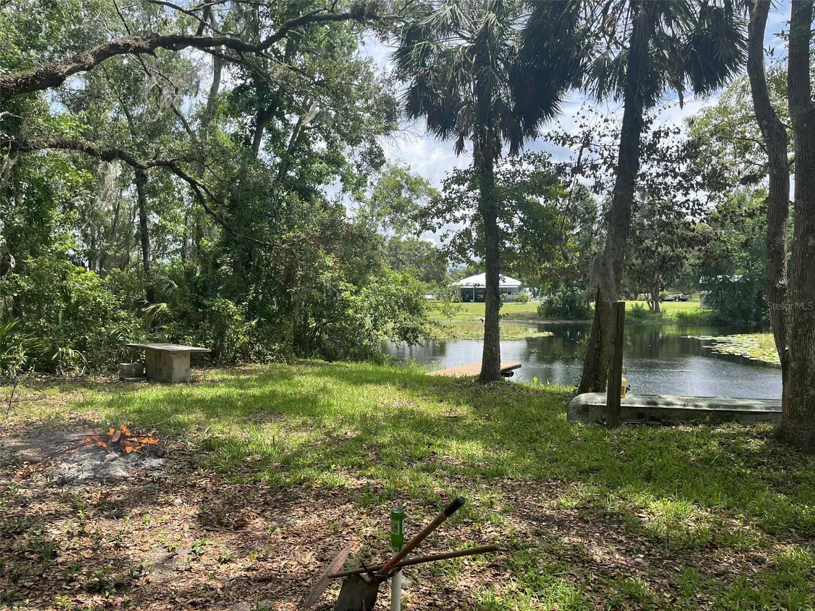 Discover the perfect opportunity to own your own slice of Florida paradise with this stunning vacant lot in Inverness, featuring 150 feet of pristine lakefront that connects directly to Lake Tsala Apopka. This rare waterfront property offers endless outdoor enjoyment with direct water access, ideal for boating, water skiing, and fishing enthusiasts alike. Imagine building your dream home (Buyer to do their own due diligence) or weekend retreat in this peaceful, natural setting surrounded by lush greenery and tranquil waters. The property includes a private dock already in place, giving you immediate access for your boat, kayak, or fishing gear. A public boat ramp is just minutes away, making it easy to launch and explore the scenic riverways and lakes in the area. This lake is teeming with fish, making it a haven for anglers of all skill levels. Whether you’re casting a line at sunrise or enjoying a sunset ski ride across the glassy waters, this property offers the perfect backdrop for a relaxed, outdoor lifestyle. Located in a quiet and desirable area of Inverness, yet just a short drive to local shops, restaurants, and amenities, this is a unique chance to invest in one of Florida’s best-kept secrets. Don’t miss this chance to own prime waterfront land with direct river access and unlimited recreational potential. Whether you’re looking to build now (Buyer to do their own due diligence) or hold as an investment, this property is a must-see! Schedule your viewing today and start living the lake life you’ve always dreamed of!