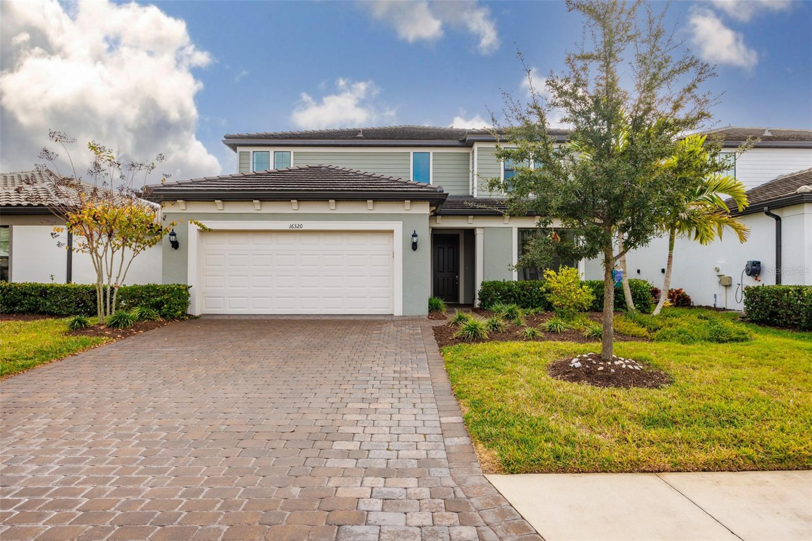 This beautiful house in the heart of Lakewood Ranch is ready for you and your family! Built only three years ago, the house is situated on a premium lot with water view you can enjoy either from your own pool or from a spacious lanai. This Yorkshire floorplan (5 bedrooms and 4.5 bathrooms) by award-winning Pulte, features the following structural upgrades: pocket sliding glass doors, 4ft garage extension that will easily accomodate SUVs and trucks, finished laundry room on the 2nd floor, gourmet kistchen with built-in kitchen appliances and an extended walk-in shower in the owner's bathroom. The interior design upgrades include white cabinets, quartz countertops throughout, kitchen backsplash, porcelain tile flooring on the first floor, luxury vinyl planks in the bedrooms. Bedroom closets and den have custom cabinets. A very spacious bonus room on the second floor is currently used as a second family/game room. Both game rooms have custom built-in shelving. 
Sapphire Point HOA covers Community Pool, Fire Pit, Clubhouse, Fitness Center, Playground, Basketball Court, Landscape Maintenance and Irrigation, Maintenance of Common Areas and Lakes, Vehicular Access Control and Professional Property Management. Residents enjoy top-rated schools, shopping, dining, parks, and proximity to Main St Lakewood Ranch, UTC, Waterside and Gulf Coast beaches.