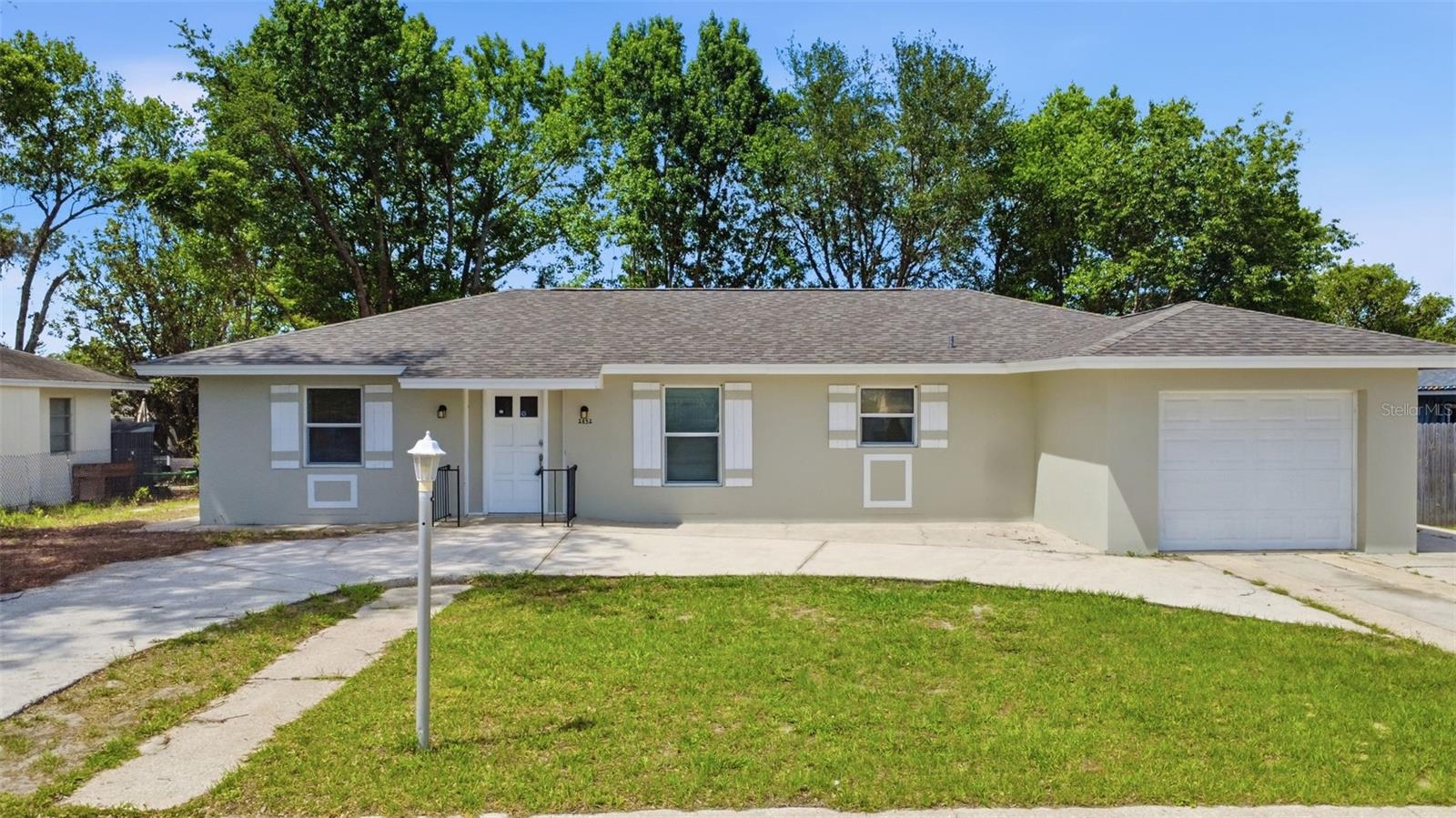 Welcome to this charming updated home that perfectly blends comfort, functionality and classic Florida living. Enjoy the freedom of ownership without the restrictions or monthly fees of an HOA. Offering 1,411 square feet of interior livable area with 3 beds and 2 full baths, making it an excellent opportunity for first-time homebuyers, down-sizers or savvy investors looking to add to their portfolio. Split plan, designed with a functional flow that maximizes privacy and shared space. Vinyl flooring and upgraded lighting throughout. BRAND NEW ROOF & 2025 HVAC! Unique circular driveway with extra space for parking. Screened-in covered porch and backyard provide ample space for gardening or any outdoor activities. This home is situated in an established, quiet residential pocket of Deltona. It offers an ideal balance of suburban tranquility and city accessibility. Located just minutes away from local parks, grocery stores, dynamic dining options, and public schools. Positioned within Volusia County with quick access to major corridors, making trips to both Orlando and Daytona Beach seamless.