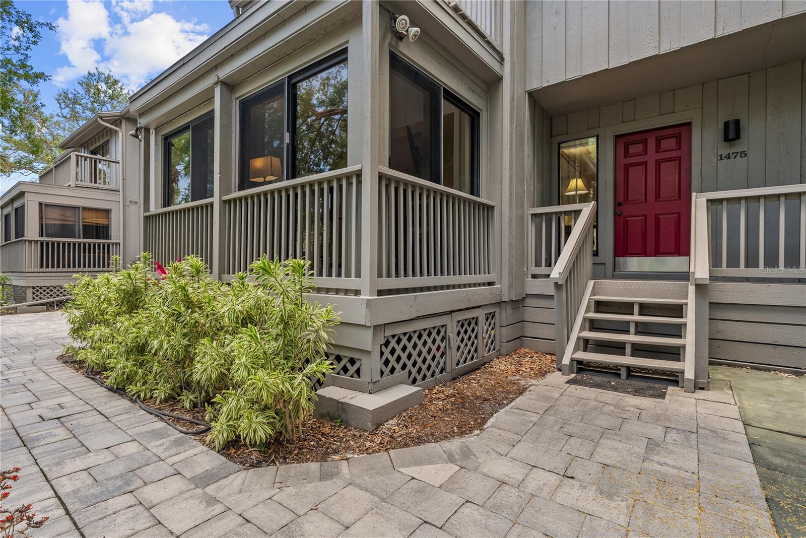 There's no place quite like it in Sarasota. Tucked into the canopy of a lush, jungle-like landscape at The Landings, this three-story Treehouse townhome delivers the rare combination of absolute privacy and natural beauty that defines one of the Gulf Coast's most beloved communities.  Soaring above the native palms and mossy oaks, this 2,040 sq ft, 3-bedroom, 2-bath + powder room residence has been thoughtfully updated while preserving the treetop retreat feeling that makes these homes so coveted. The 2025 renovated kitchen features fresh cabinetry and all-new washer and dryer ? move-in ready with nothing to do but settle in and listen to the breeze. A wood-burning fireplace anchors the living space with warmth and character, while multiple decks off each level bring the outdoors in at every turn.  A private garage, generous lanai, and verdant views from nearly every window complete the picture. Exterior maintenance is included, so the only thing on your to-do list is enjoying it. And for those who travel with four-legged family members ? pets are welcome here with no weight restrictions.  The Landings is a gated waterfront community offering residents access to Har-Tru tennis courts, a community pool, and the private Landings Yacht, Golf & Tennis Club (optional membership). All just minutes from world-class dining, the arts, and the sugar sands of Siesta Key.  This is more than a home ? it's a lifestyle hiding in plain sight.